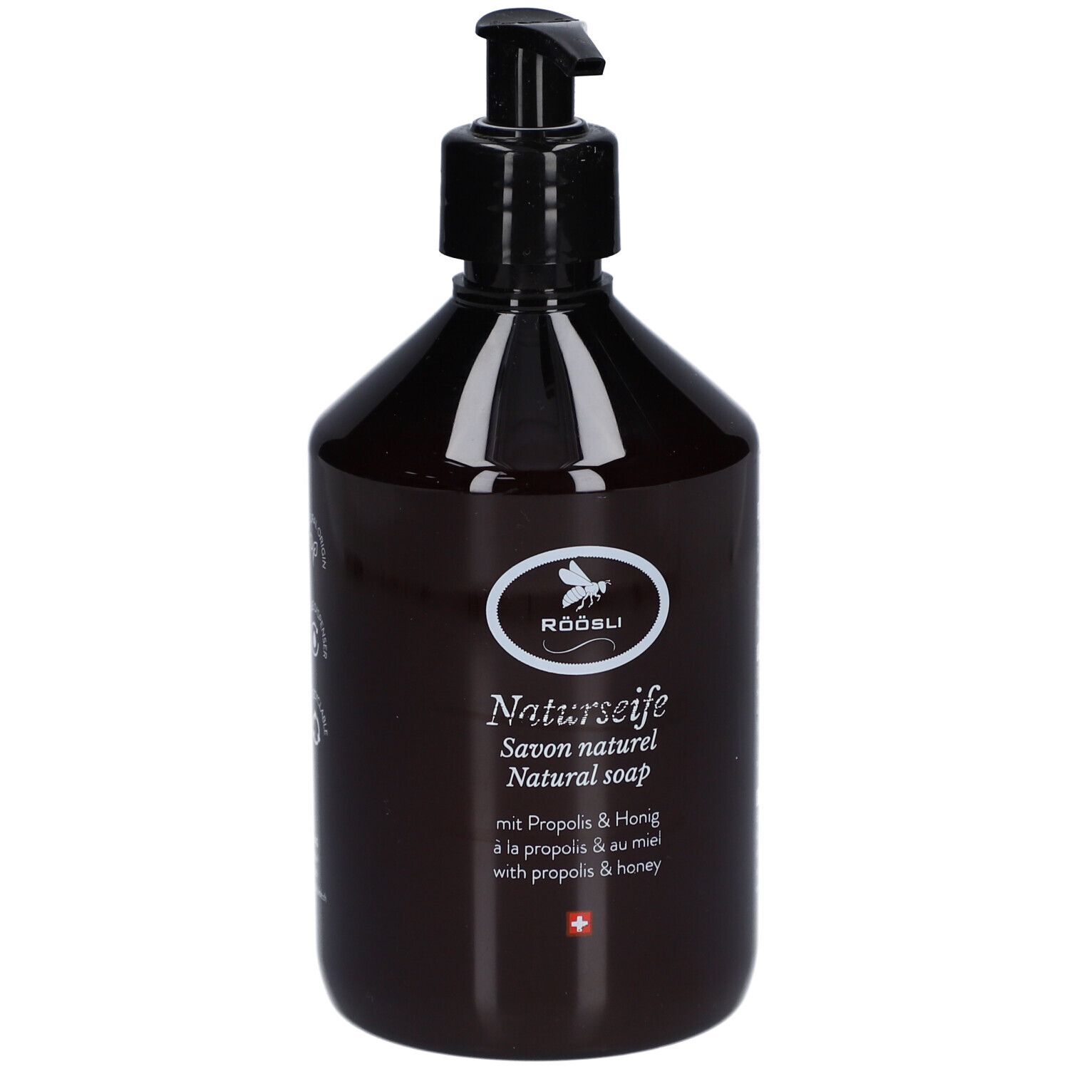 Flacon brun avec pompe noire. Inscription: RÖÖSLI Naturseife, Savon naturel, Natural soap. Avec Propolis & Miel.