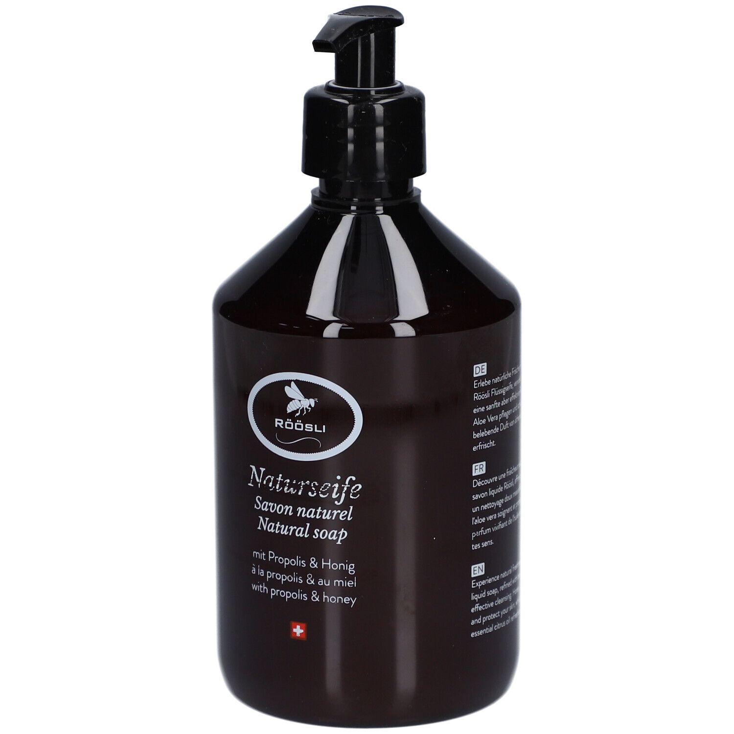 Flacon brun avec pompe noire. Inscription: RÖÖSLI Naturseife, Savon naturel, Natural soap. Avec Propolis & Miel.