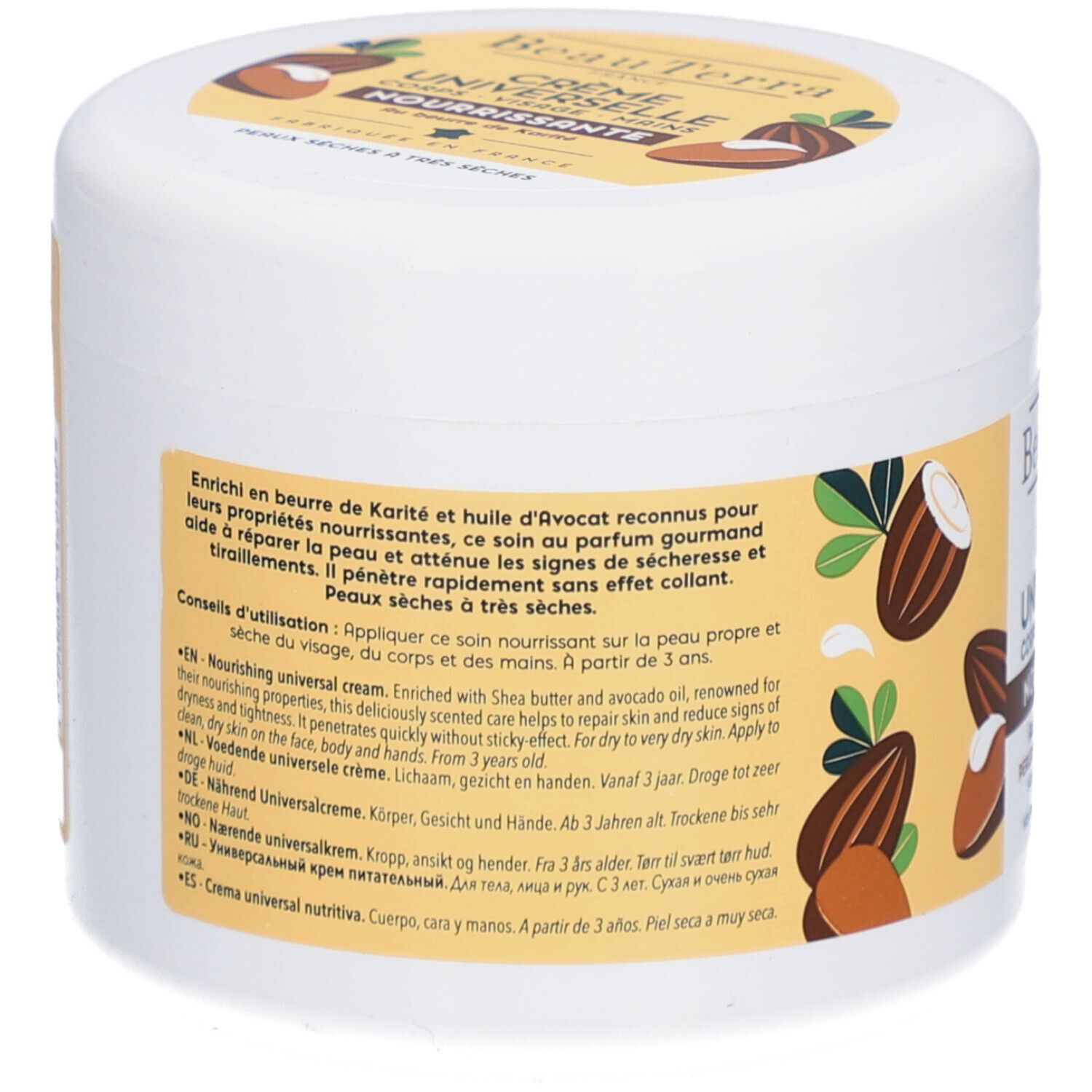 Rückseite des weißen Tiegels. Text in mehreren Sprachen. Enthält Shea Butter und Avocadoöl. Für trockene bis sehr trockene Haut.