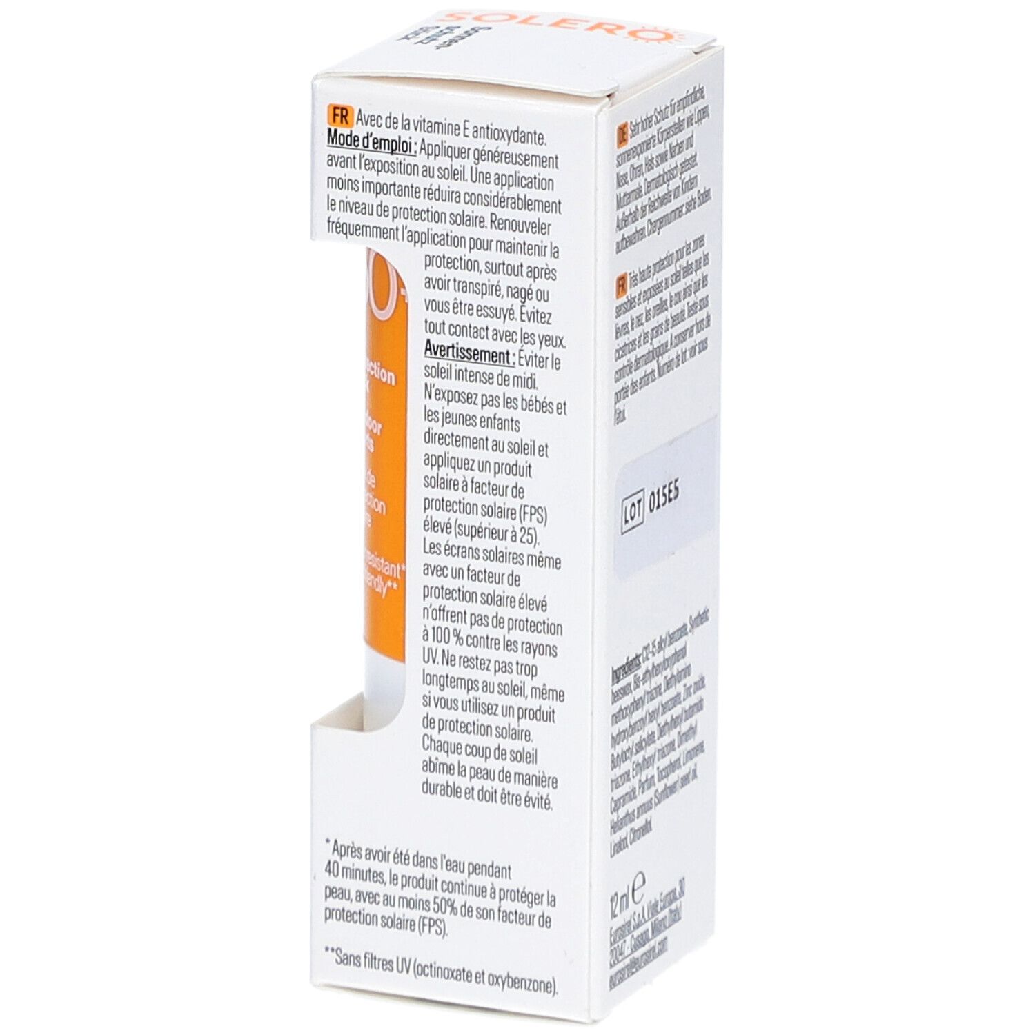 Emballage du stick solaire SOLERO. Contient des informations sur l'utilisation. Texte: 12 ml. Numéro de lot: 015E5. Bâton orange visible.