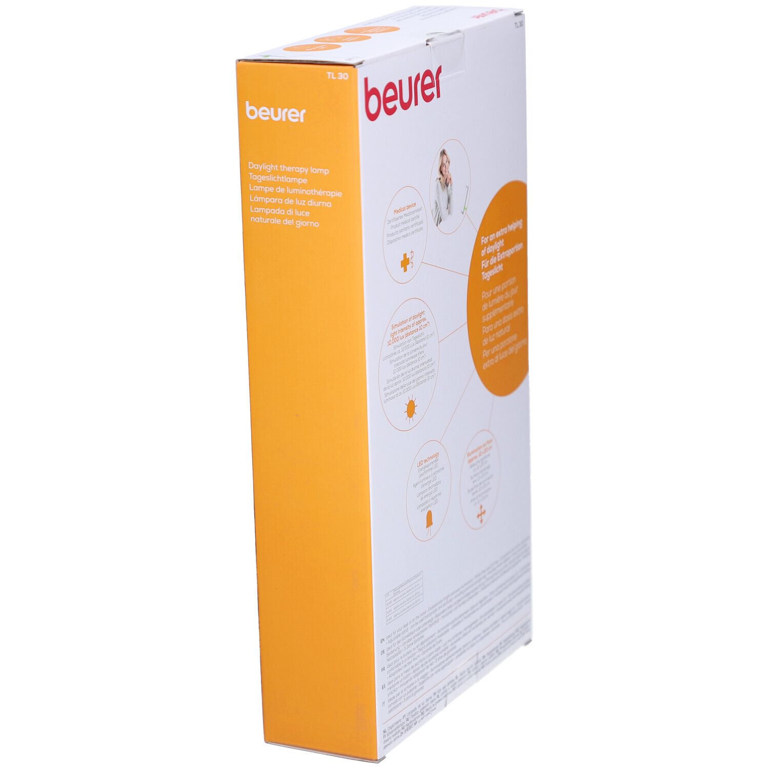 Seitenansicht der Verpackung der Tageslichtlampe. Aufdrucke: Beurer, Informationen zur Tageslichtlampe, Piktogramme.