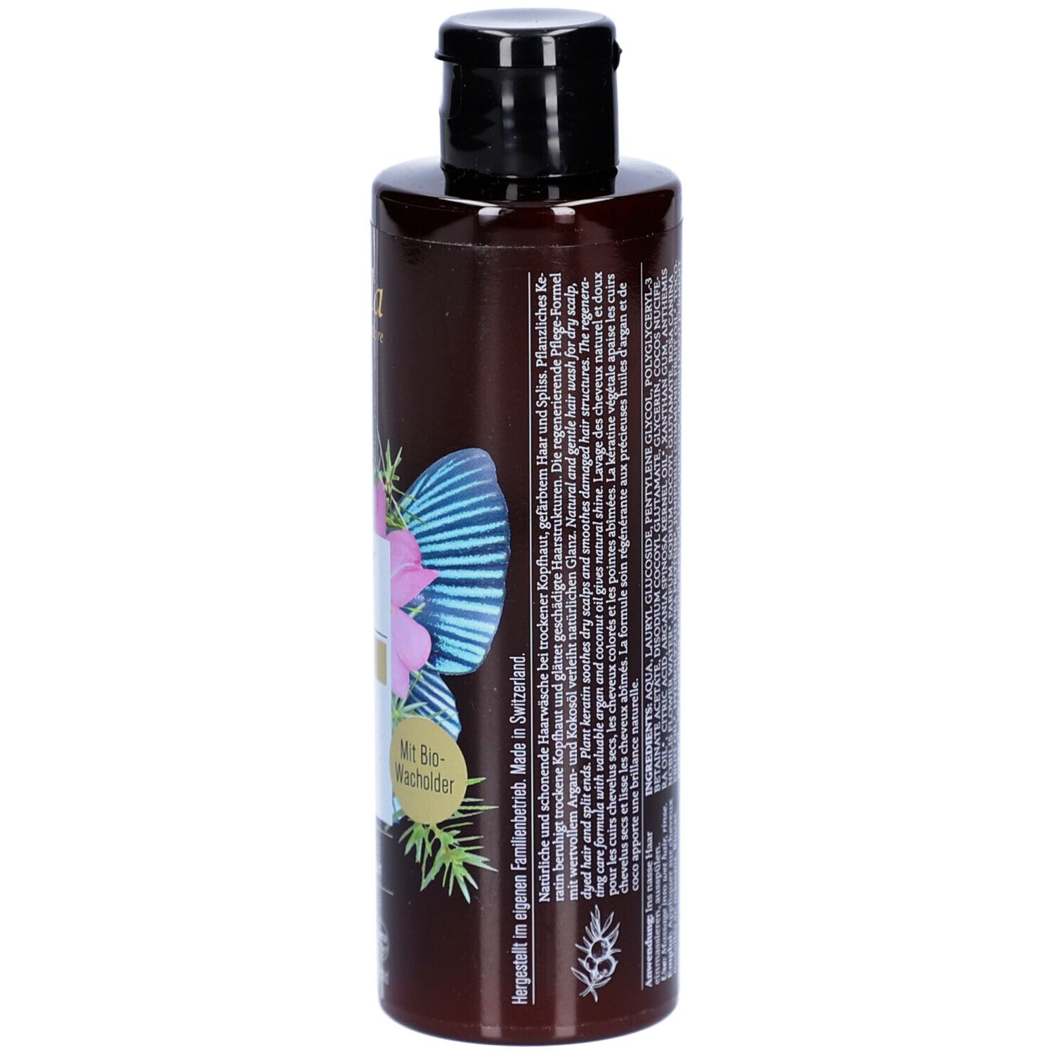 Braune Shampoo-Flasche, Seitenansicht. Aufschrift: Nutri Repair Shampoo, Phyto Keratin. Mit Bio-Wacholder. Hergestellt in der Schweiz.