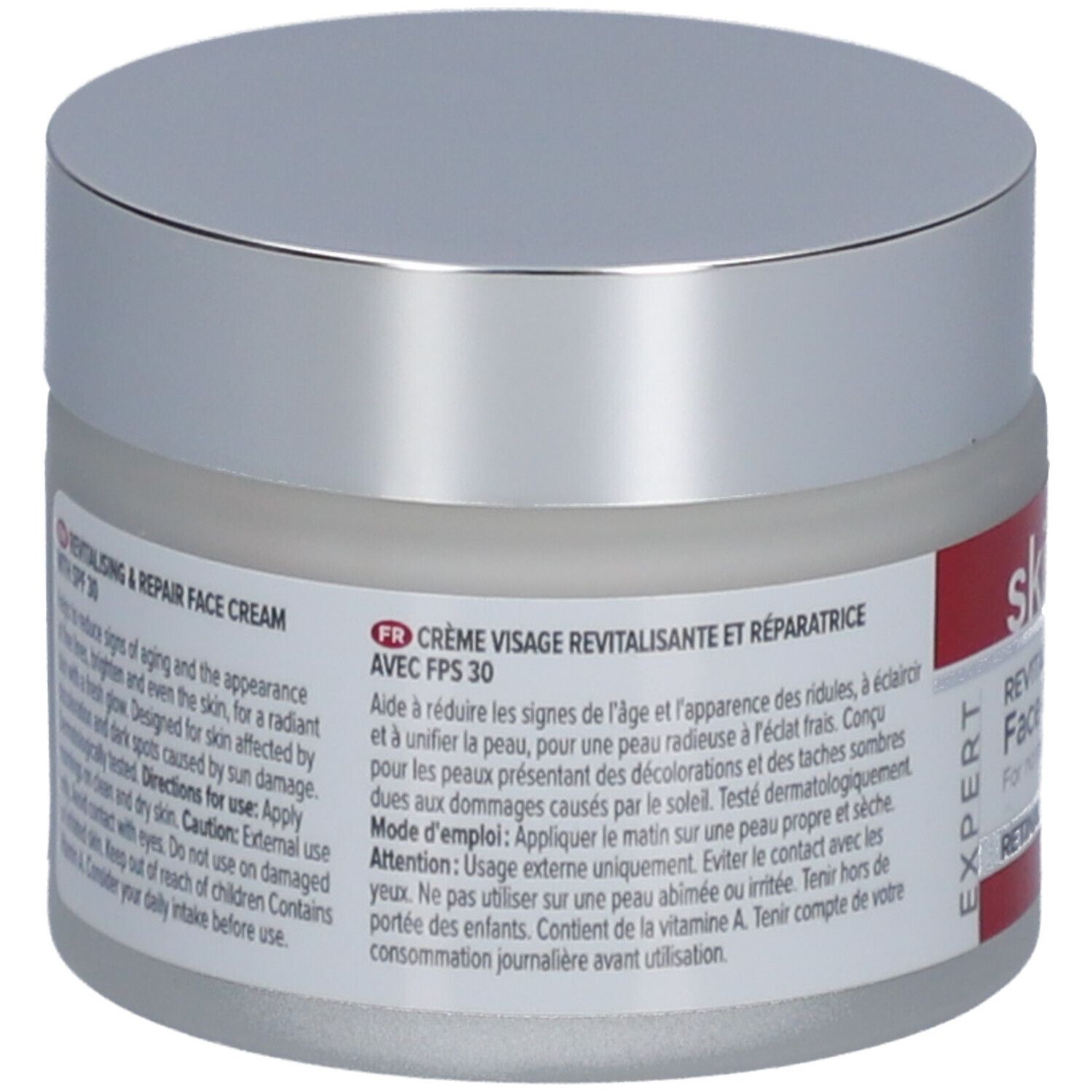 Rückseite des Creme-Tiegels mit Text. Aufschrift: Revitalisierende & Reparierende Gesichtscreme mit SPF 30. Text in Französisch.