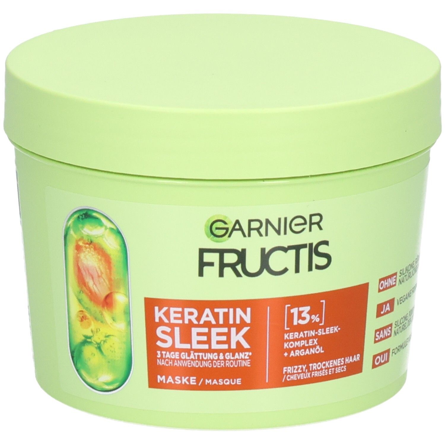 Garnier Fructis Keratin Sleek Maske in einem hellgrünen Tiegel mit orangefarbenem Etikett.