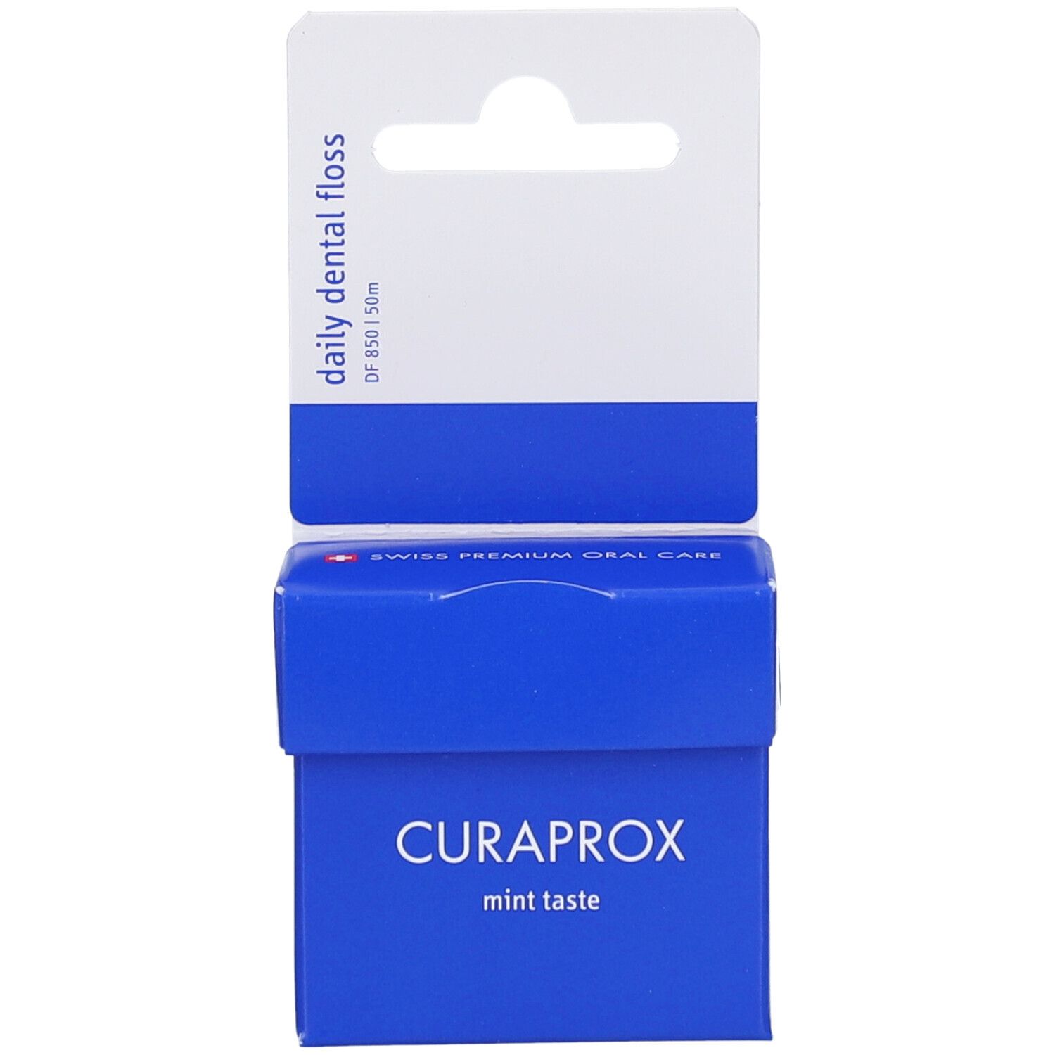 Blaue Verpackung mit weißem Aufhänger. CURAPROX-Logo und Text. Enthält Zahnseide. Aufdruck: mint taste.
