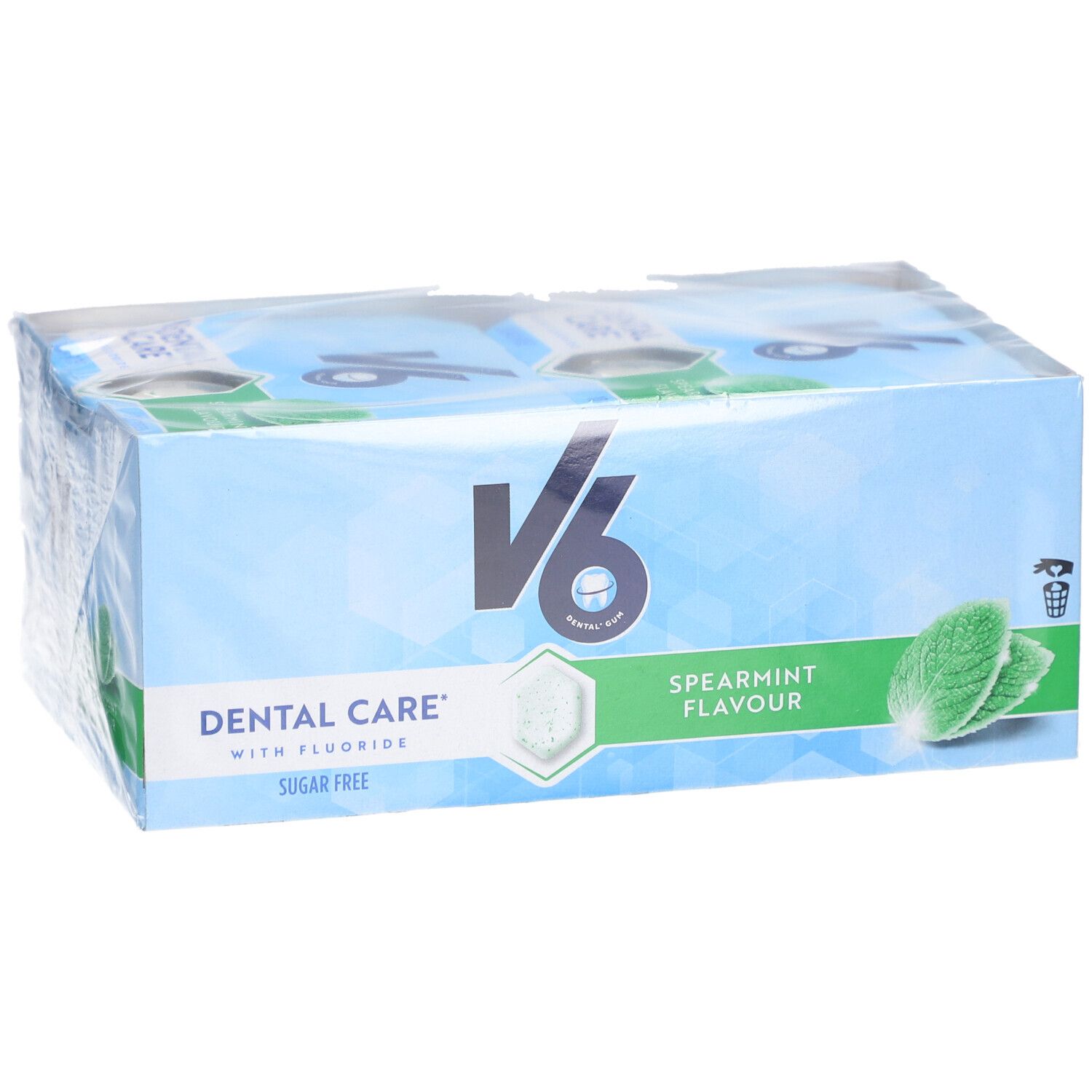 Verpackung mit V6 Kaugummi. Aufschrift: Dental Care, Spearmint Flavour, Sugar Free. Mint-Blätter und hexagonale Form.