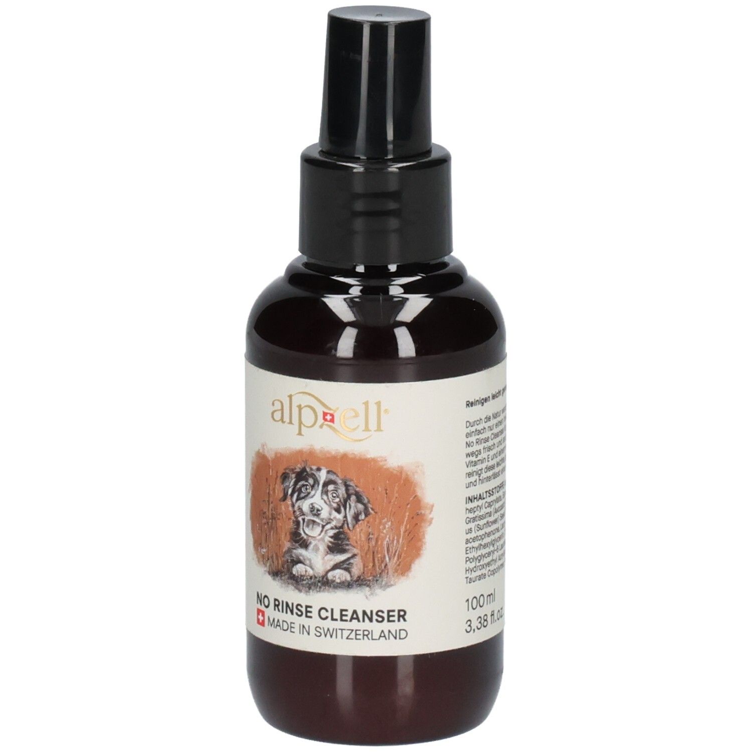 Braune Flasche mit schwarzem Sprühkopf. Etikett mit Logo, Hund, Text "NO RINSE CLEANSER" und "MADE IN SWITZERLAND".