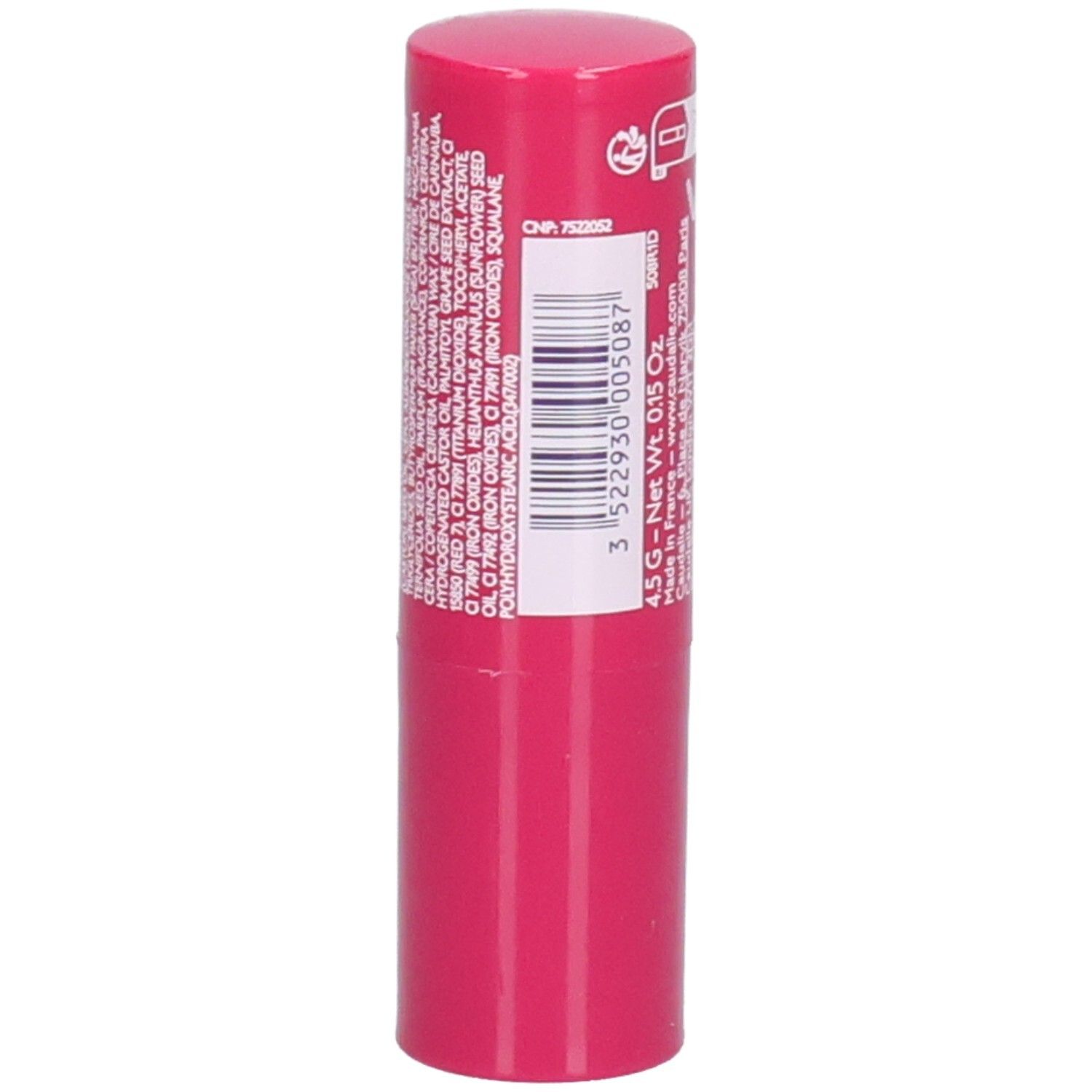 Bâton de baume à lèvres rose. Dos avec ingrédients et code-barres. Marque CAUDALIE.