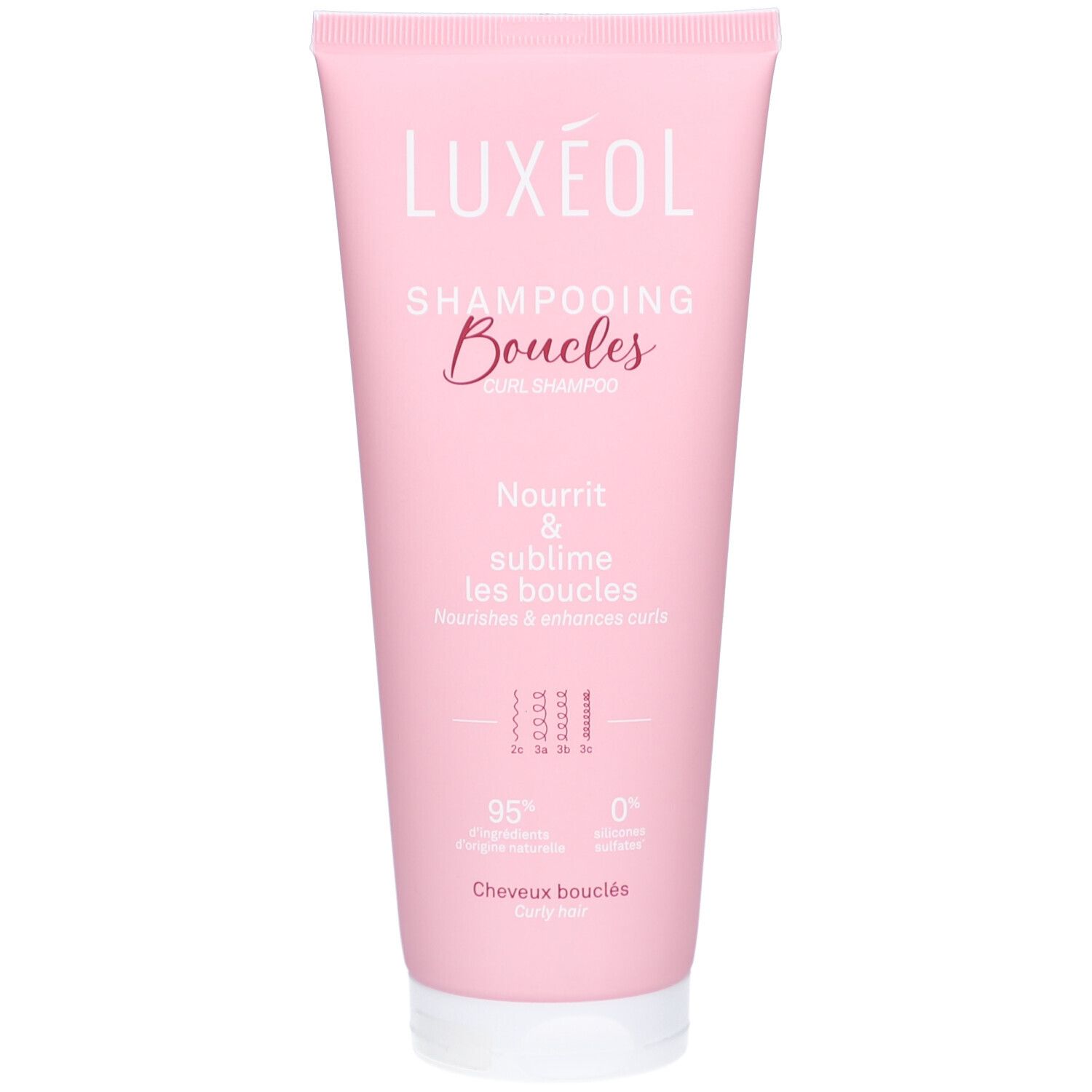 Rosa Tube mit LUXEOL Lockenshampoo. Schriftzug "Shampooing Boucles". Text "Nourrit & sublime les boucles".