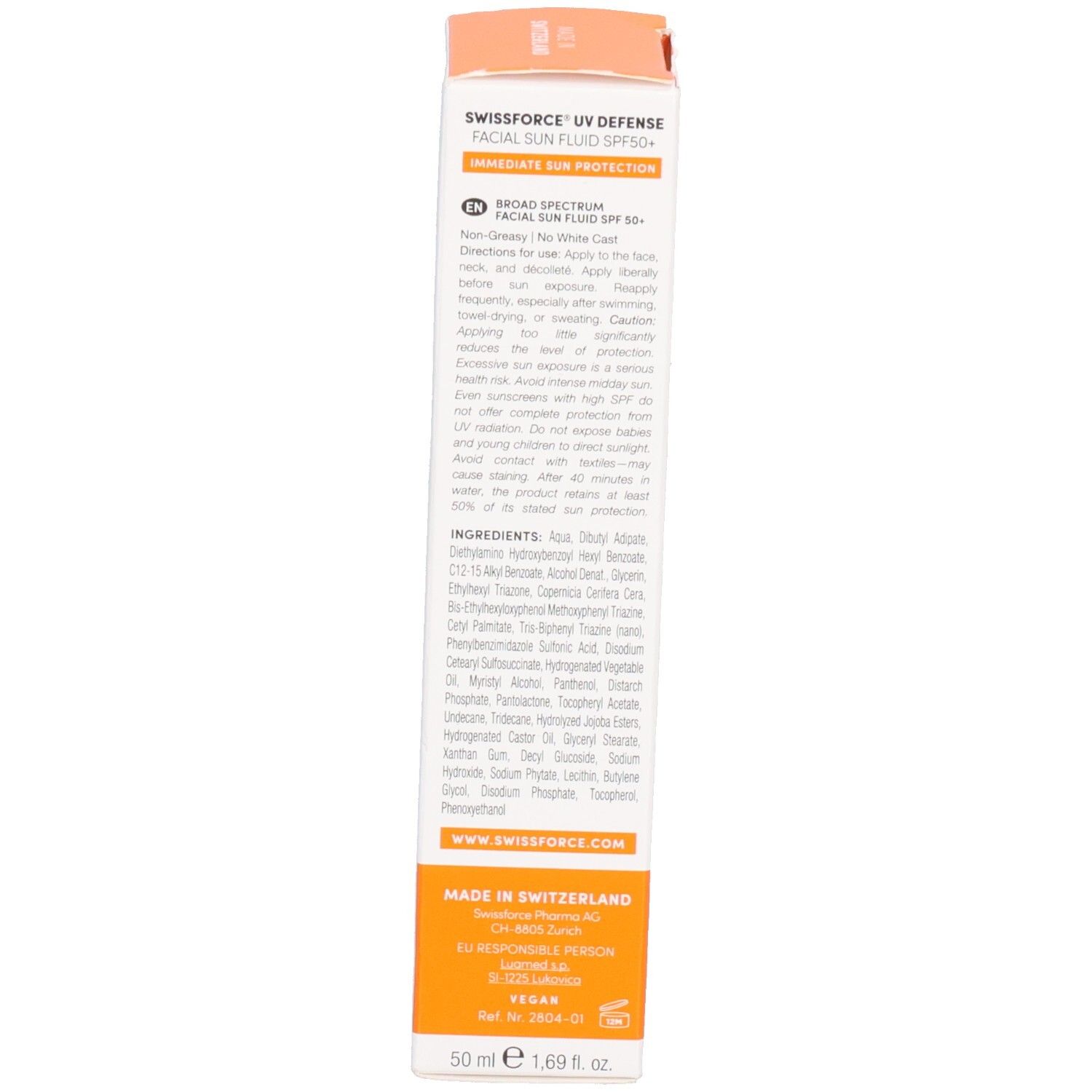 Rückseite der Verpackung. Text: Facial Sun Fluid LSF 50+. Inhaltsstoffe und Anwendungshinweise. Made in Switzerland.