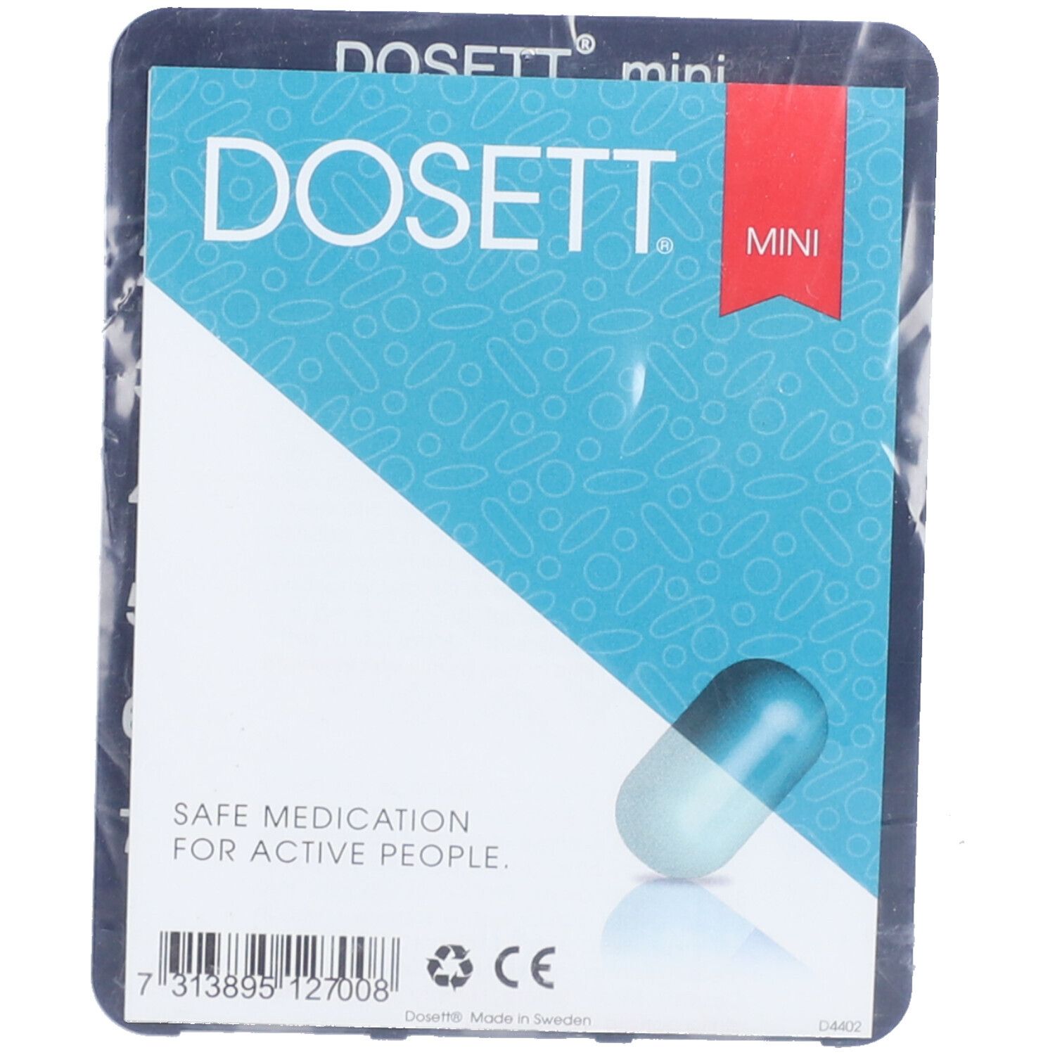 Verpackung mit Produktetikett. DOSETT mini Pillendose. Blaue Kapsel-Illustration. Text: SAFE MEDICATION FOR ACTIVE PEOPLE.