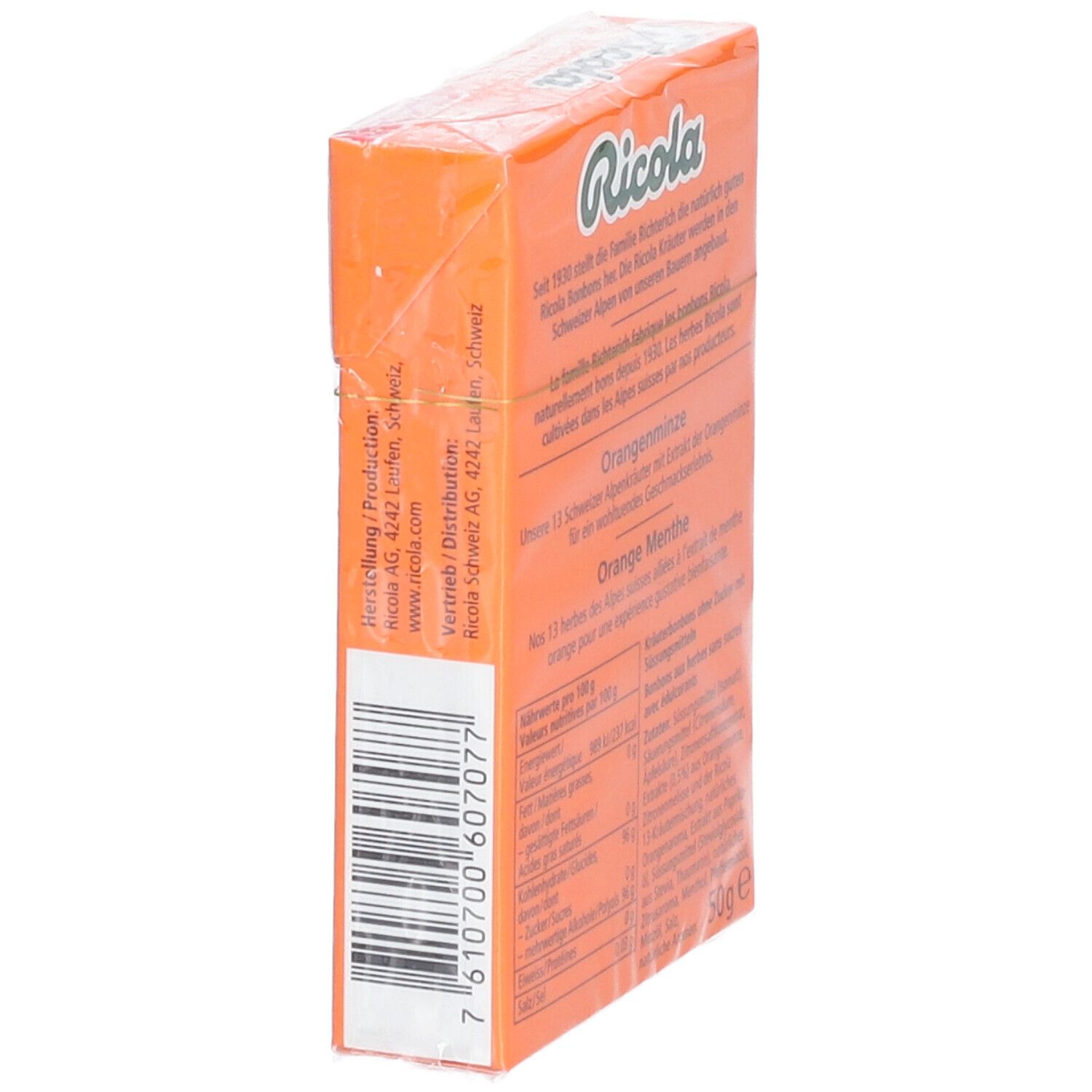 Côté de l'emballage des bonbons Ricola Orange menthe. Code-barres et texte.
