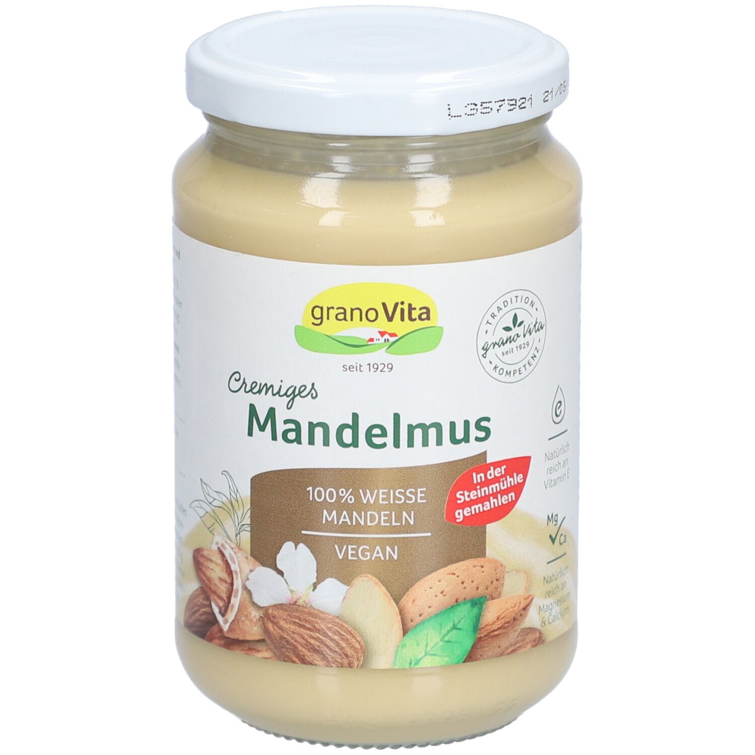 Glas mit Cremiges Mandelmousse. Aufschrift: granaVita, Mandelmuss, 100% weisse Mandeln, vegan. Abbildung von Mandeln.