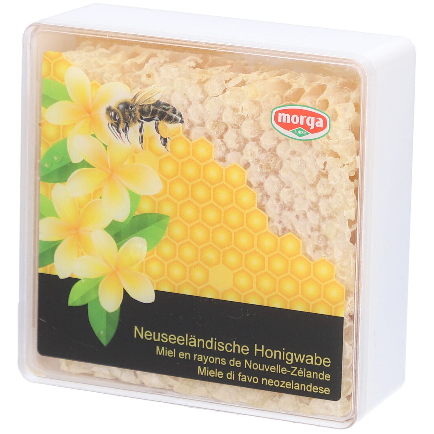 MORGA miel en rayons. Emballage transparent carré avec rayon de miel, fleurs et abeille. Texte: Miel en rayons de Nouvelle-Zélande.