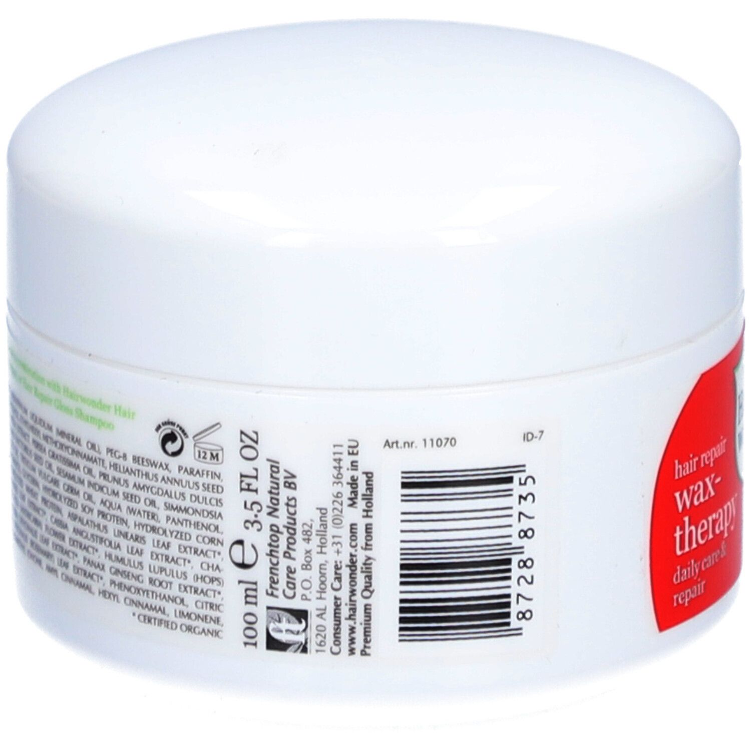 Pot blanc avec étiquette rouge. Inscription : Hairwonder Wax-thérapie. Contient 100 ml. Ingrédients et informations du fabricant sur le côté.