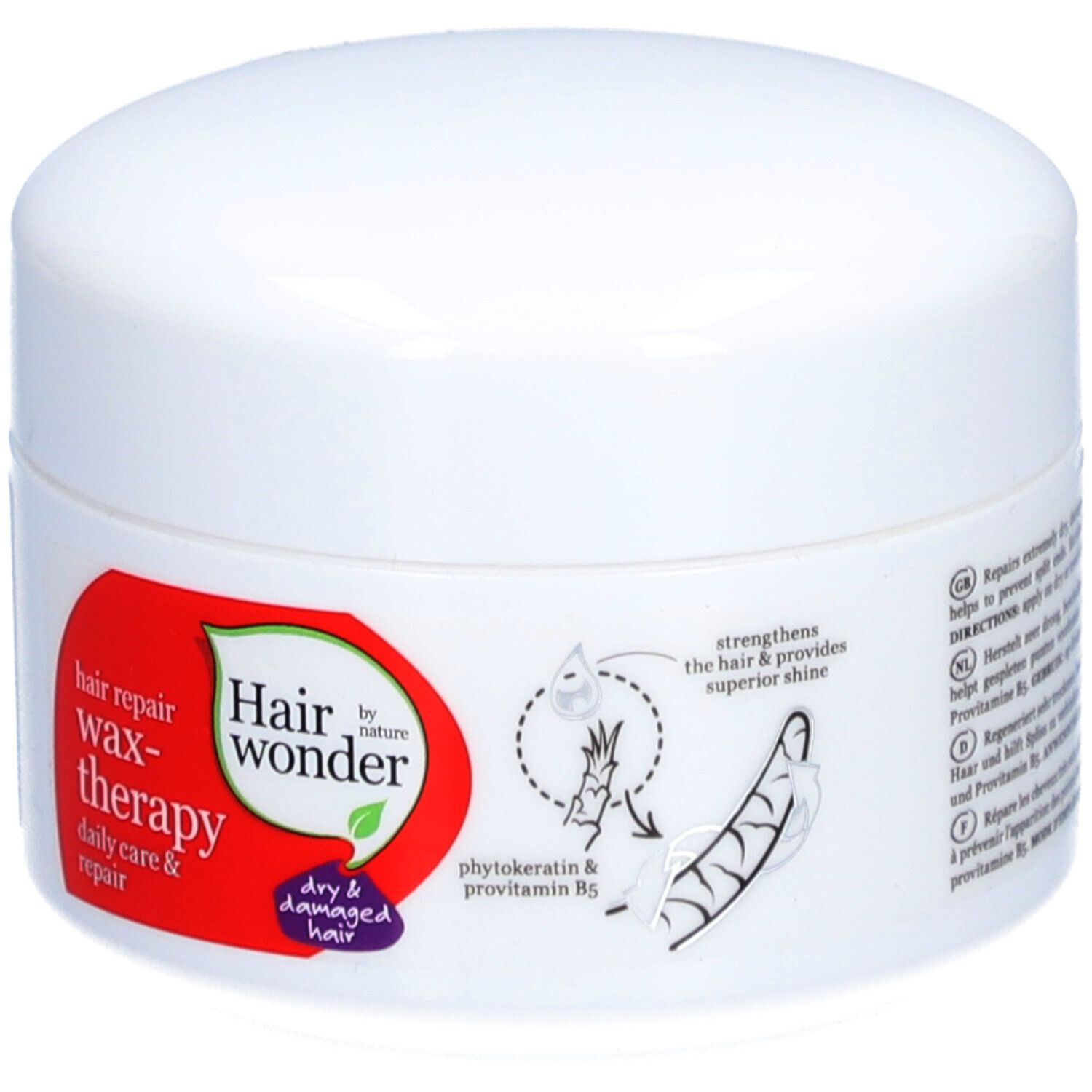Pot blanc avec étiquette rouge. Inscription : Hairwonder Wax-thérapie. Contient de la phytokératine et de la provitamine B5. Pour cheveux secs et abîmés.