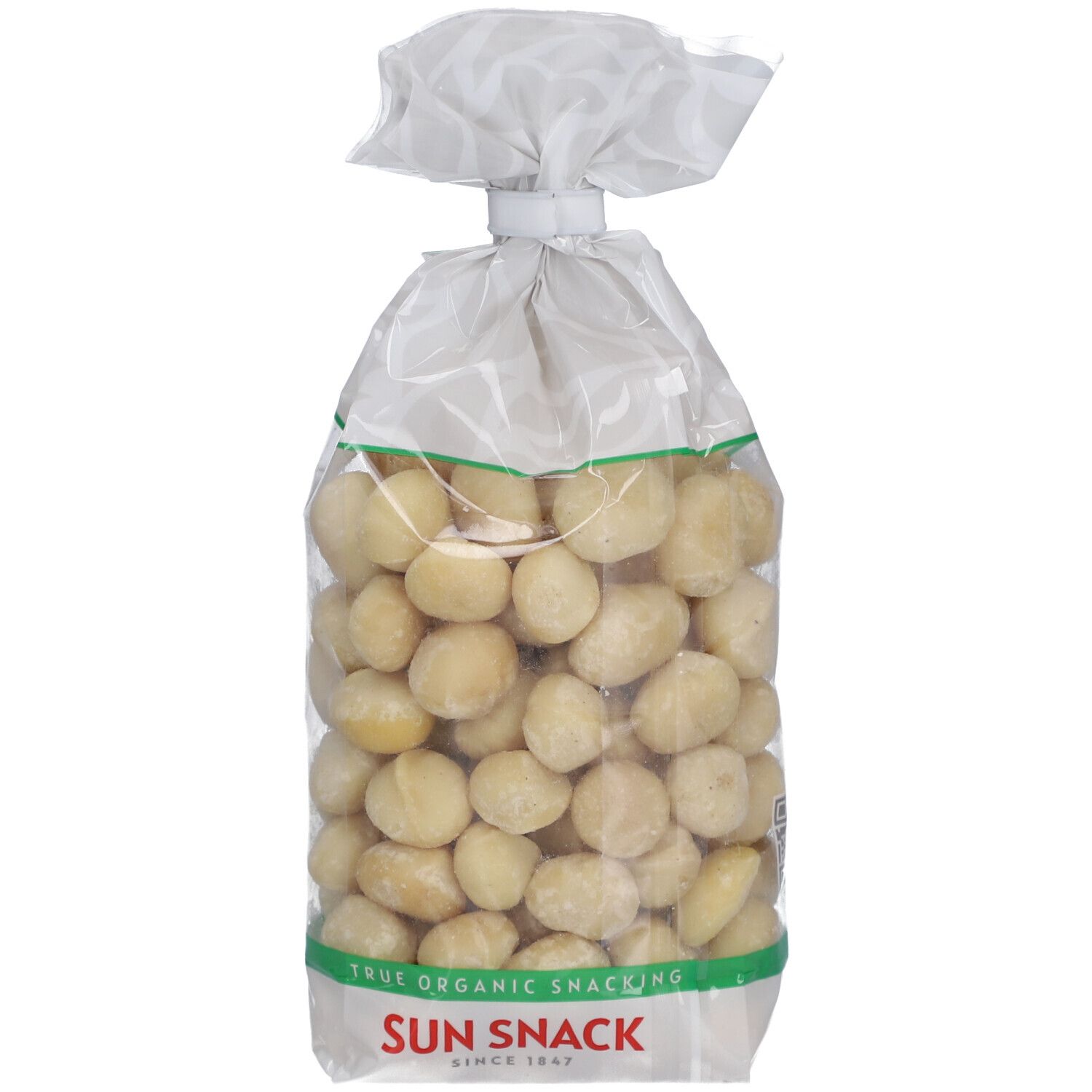 Transparente Tüte mit Bio Macadamia Nüssen. Grün-weißes Etikett mit Produktname und Logo.