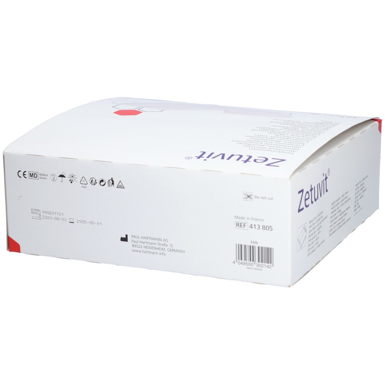 Dos de la boîte Zetuvit®. Boîte blanche avec informations produit, adresse fabricant et code-barres.