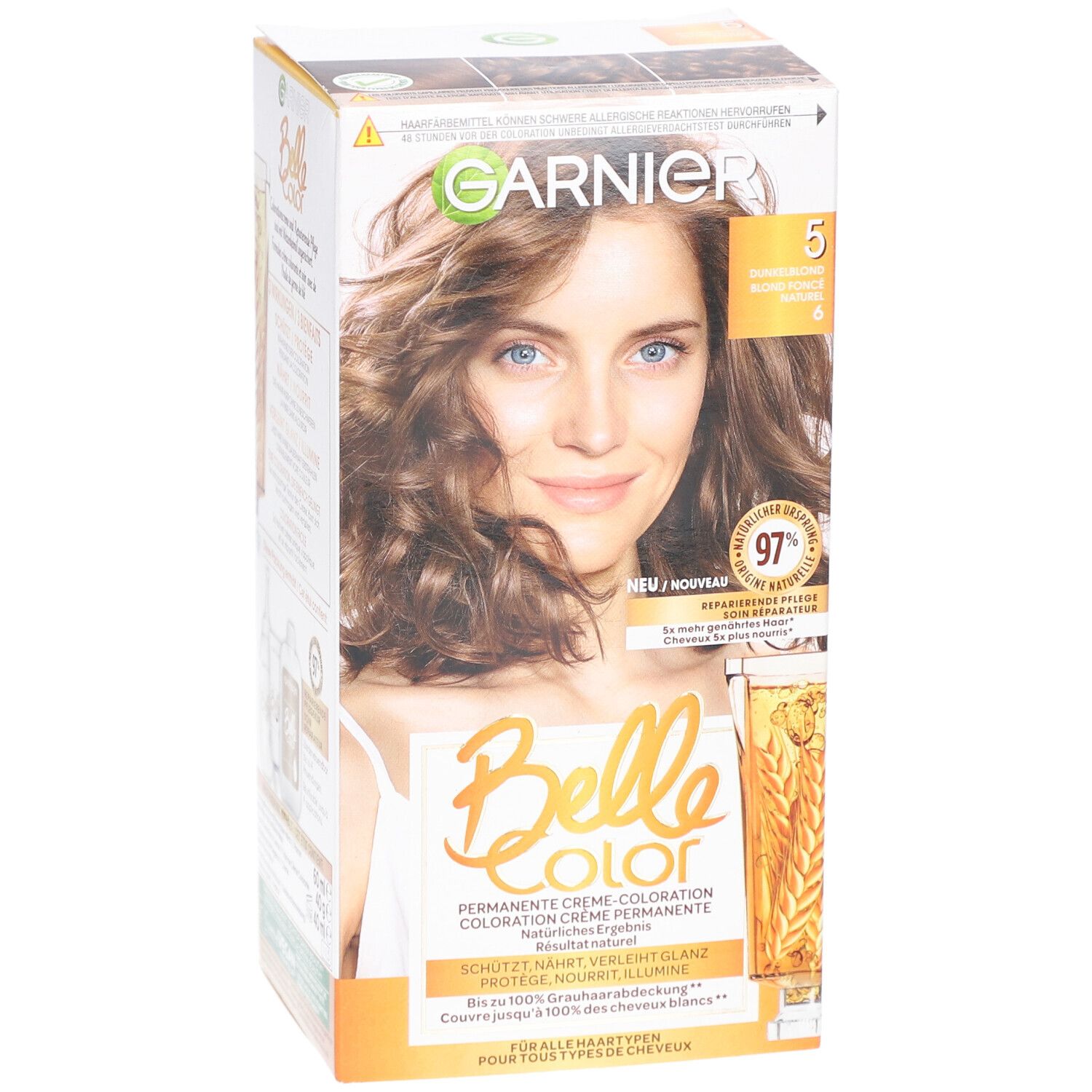 Garnier Belle Color-Verpackung, Vorderseite. Frau mit braunen Haaren. Aufdruck: 5, Dunkelblond, 97% reparierte Spitzen. Für alle Haartypen.