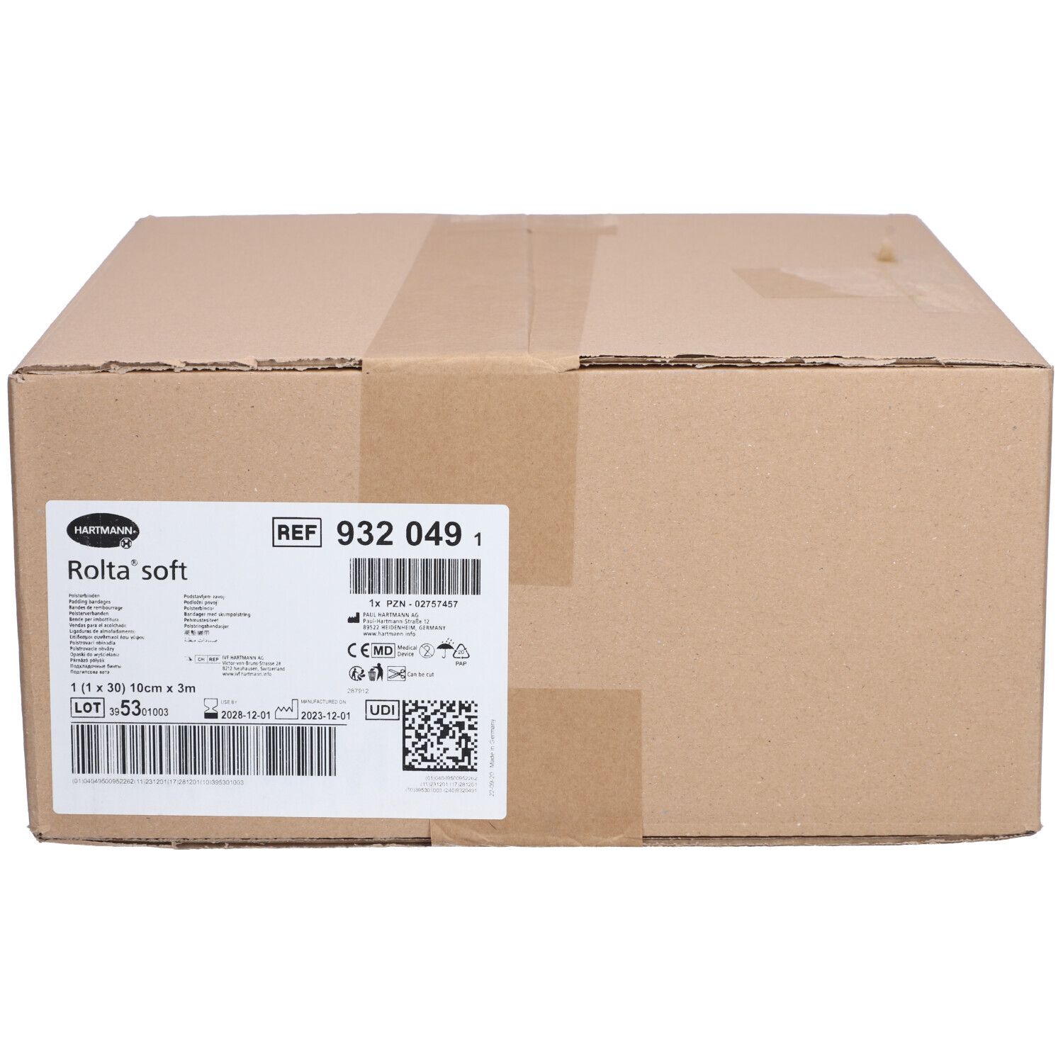 Boîte en carton avec étiquette. L'étiquette indique "HARTMANN Rolta'soft" et des informations sur le produit. Numéro de référence : 932 049 1.