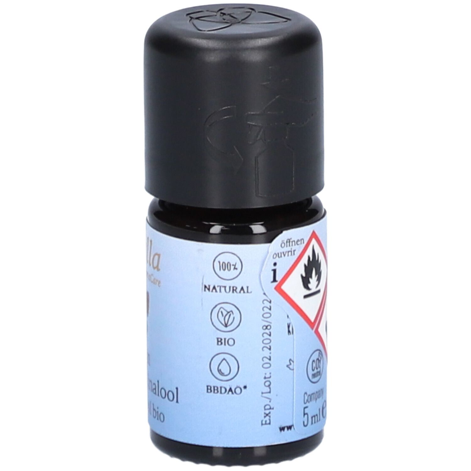 Flacon en verre brun avec bouchon noir. Étiquette avec symboles d'avertissement, logos et "5ml e".