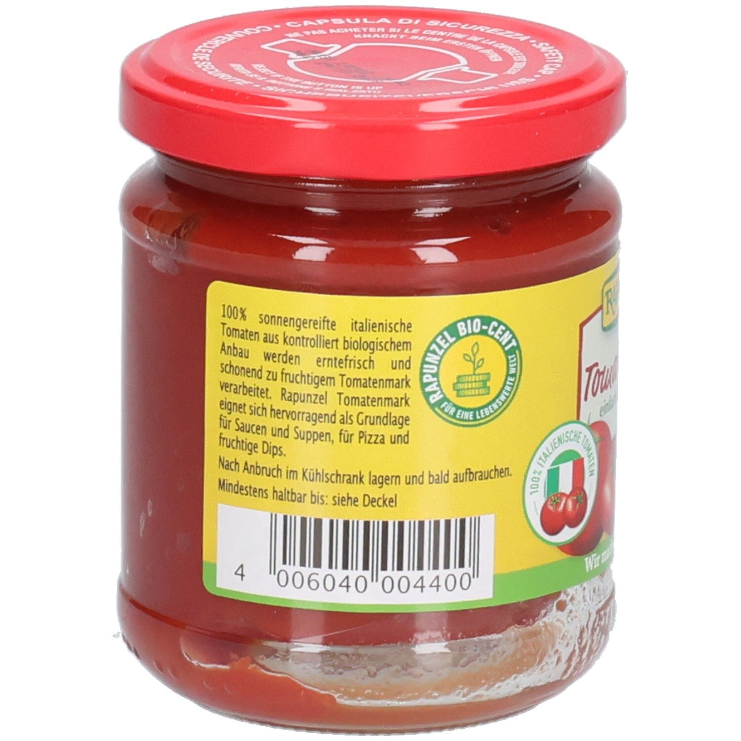 Rückseite des Glases mit Tomatenmark. Etikett mit Text, Barcode, Bio-Siegel und italienischer Flagge.