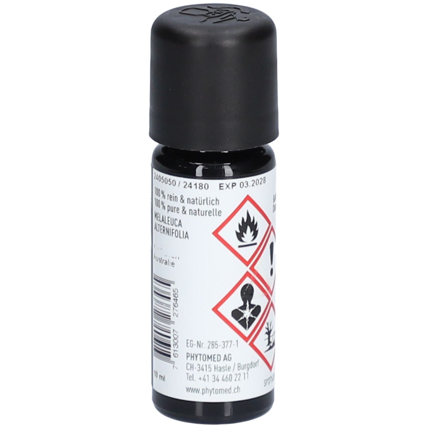 Flacon en verre brun avec bouchon noir. Inscription : 100% pur & naturel, Melaleuca Alternifolia. EXP 03.2028. Marque : PHYTOMED.