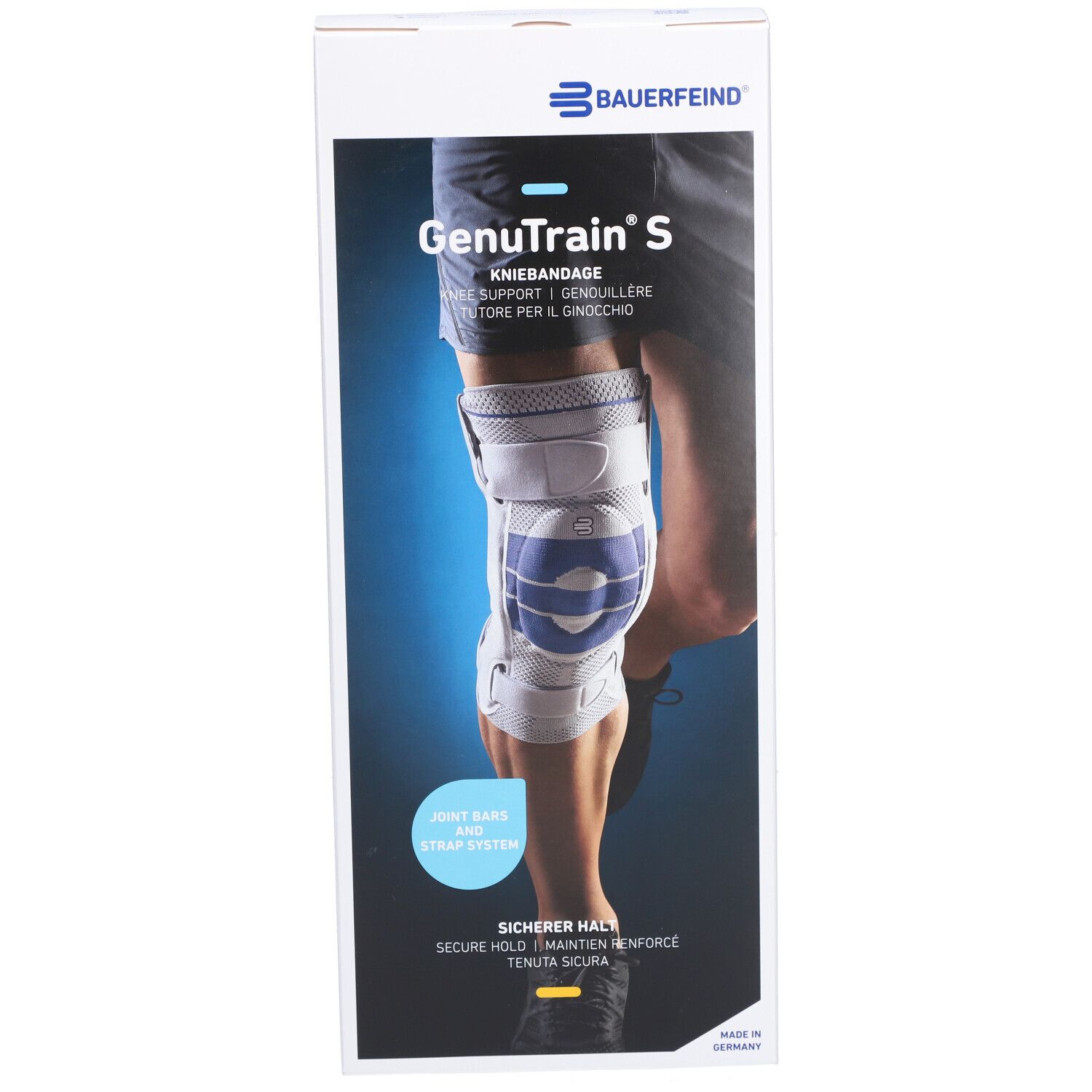 Kniebandage in Verpackung. Marke: BAUERFEIND. Produktname: GenuTrain S. Text: Kniebandage, Joint Bar and Strap System, Sicherer Halt.