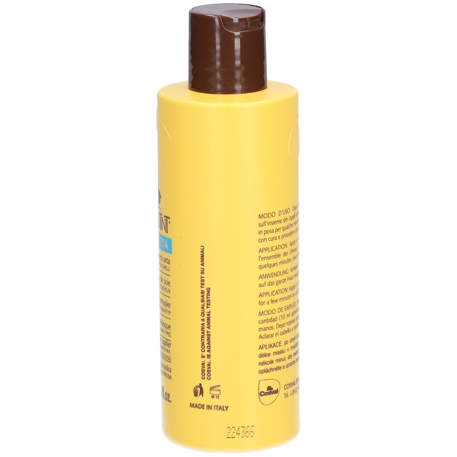 Flacon jaune avec bouchon marron. Dos avec texte. 200 ml.