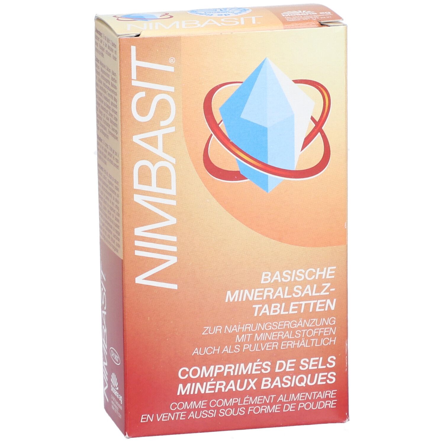 Vue en biais de l'emballage des comprimés NIMBASIT. Inscription: Comprimés de sels minéraux basiques. Logo: cristal bleu avec anneau rouge.