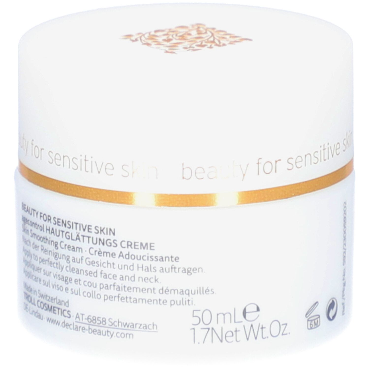 Weißer Tiegel mit Deckel. Goldener Zierstreifen. DECLARÉ-Logo und Produktbezeichnung. Aufschrift: Hautglättungs Creme. 50 ml.