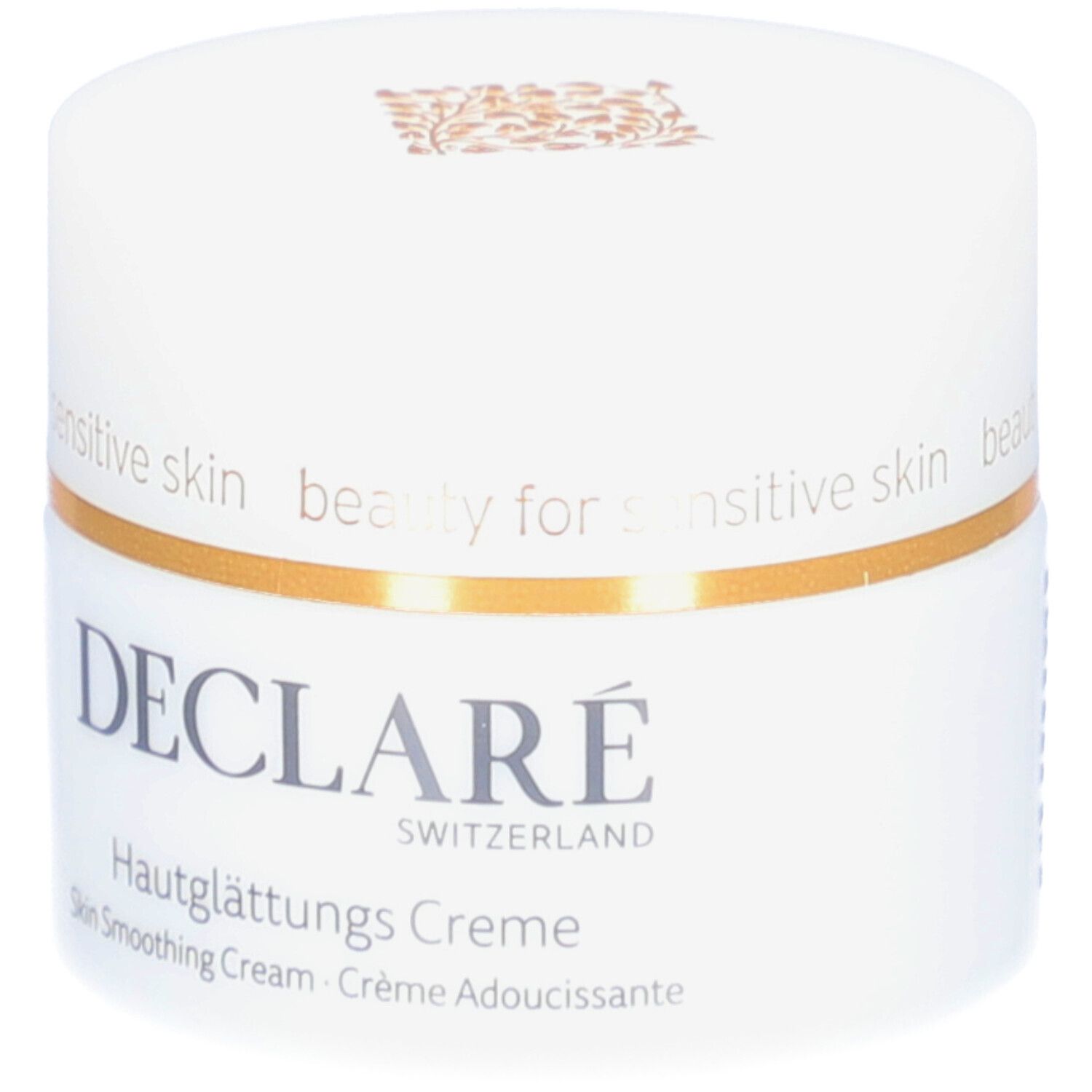 Weißer Tiegel mit Deckel. Goldener Zierstreifen. DECLARÉ-Logo und Produktbezeichnung. Aufschrift: Hautglättungs Creme.