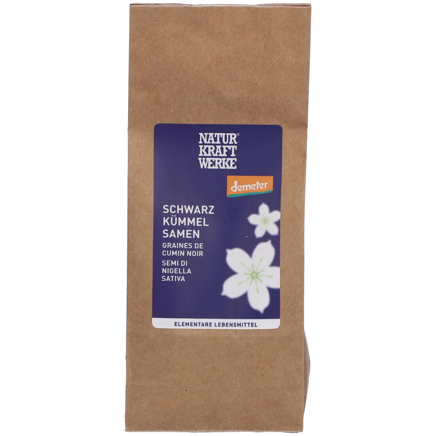 Braune Papiertüte mit blauem Etikett. Aufschrift: NATURKRAFTWERKE, Schwarzkümmelsamen, Demeter-Logo.