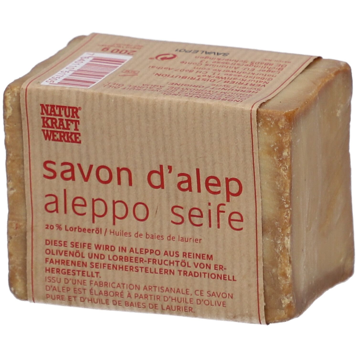 Rechteckige Seife mit Papierbanderole. Aufschrift: savon d'alep aleppo seife, 20% Lorbeeröl. Natur Kraft Werke.