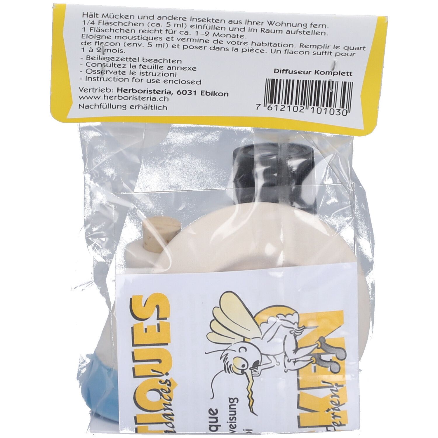 Rückseite der Verpackung. Text mit Gebrauchsanweisung. Diffusor und Zubehör sichtbar. Barcode und Logo.