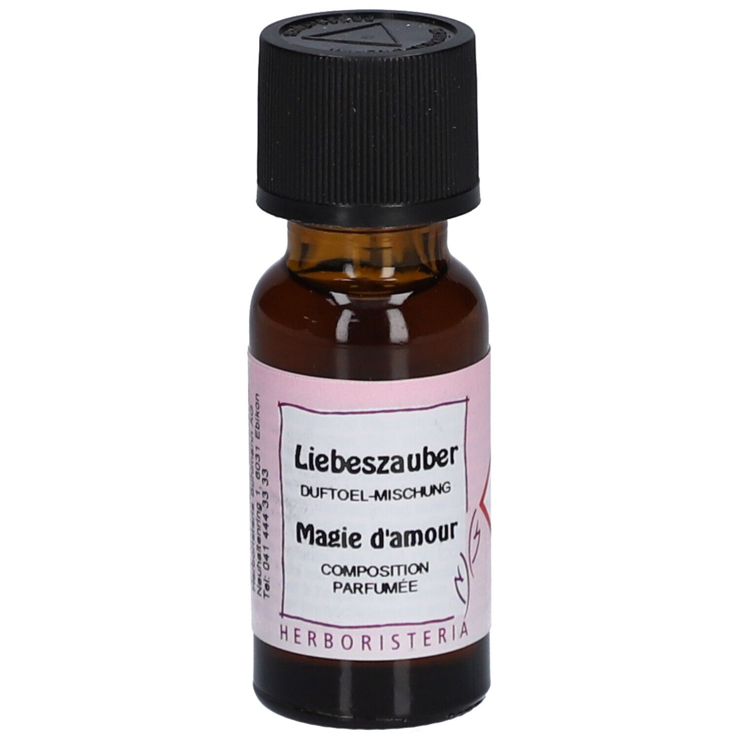 Flacon en verre brun avec bouchon noir. Étiquette avec texte: Liebeszauber, Magie d'amour, HERBORISTERIA.