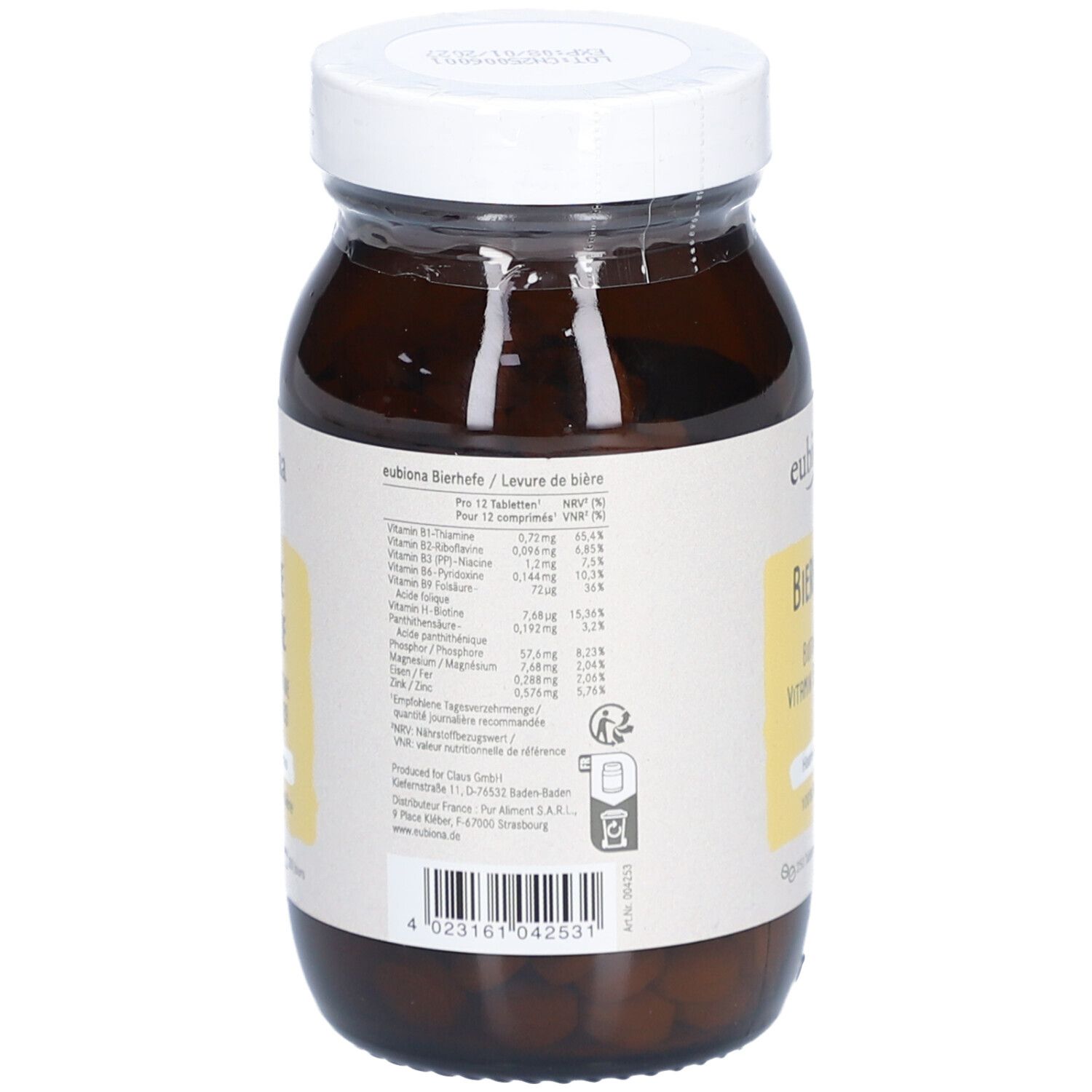 Dos du flacon en verre brun. Étiquette avec informations nutritionnelles et fabricant.