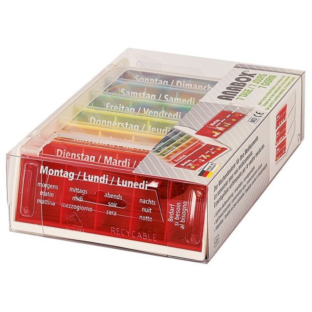 ANABOX distributeur de médicaments, 7 jours colorés. Récipient rouge transparent avec compartiments colorés. Étiquetage en allemand, français, italien.