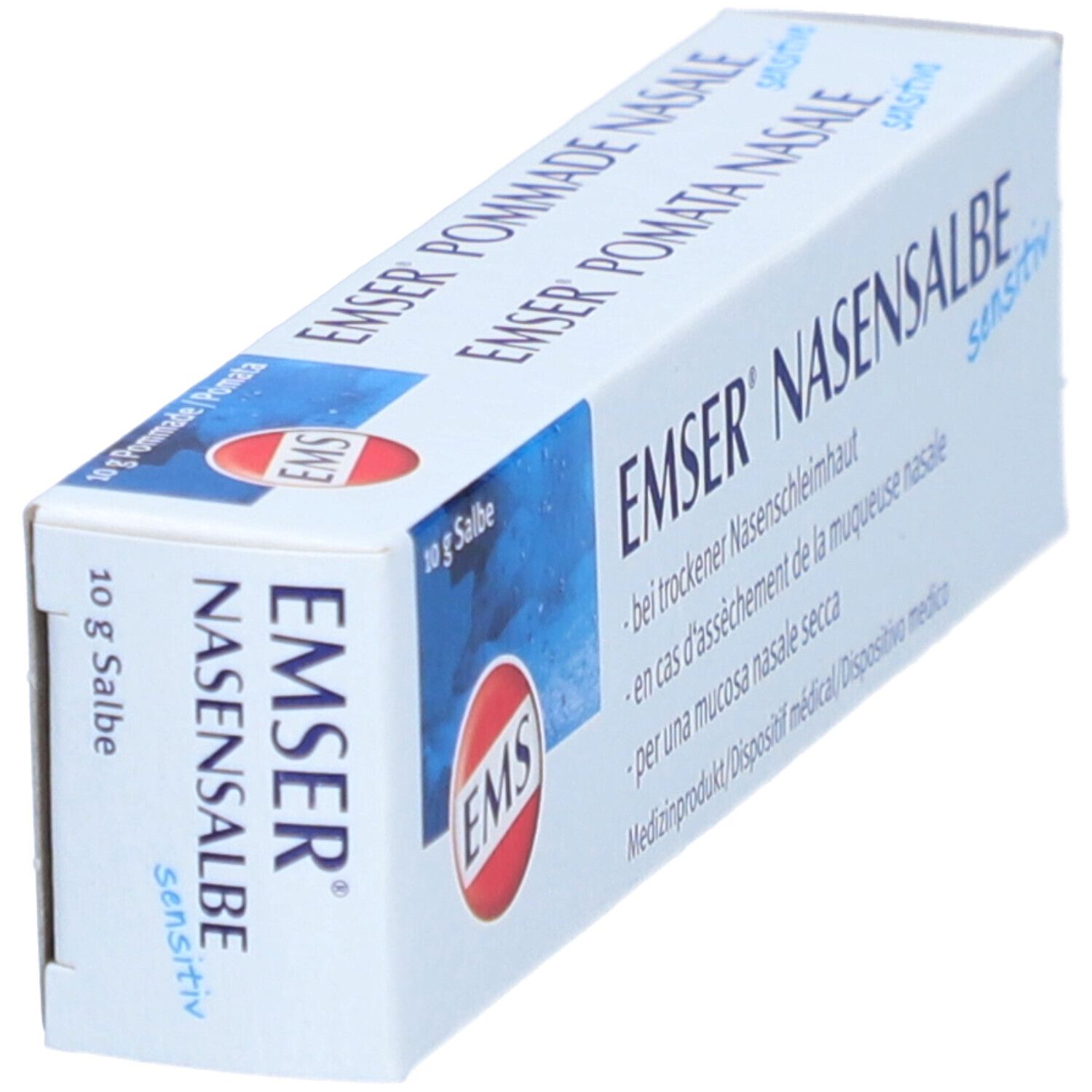 Schräg gestellte Produktverpackung. Weißer Karton mit Produktnamen und Logo. Text in mehreren Sprachen.