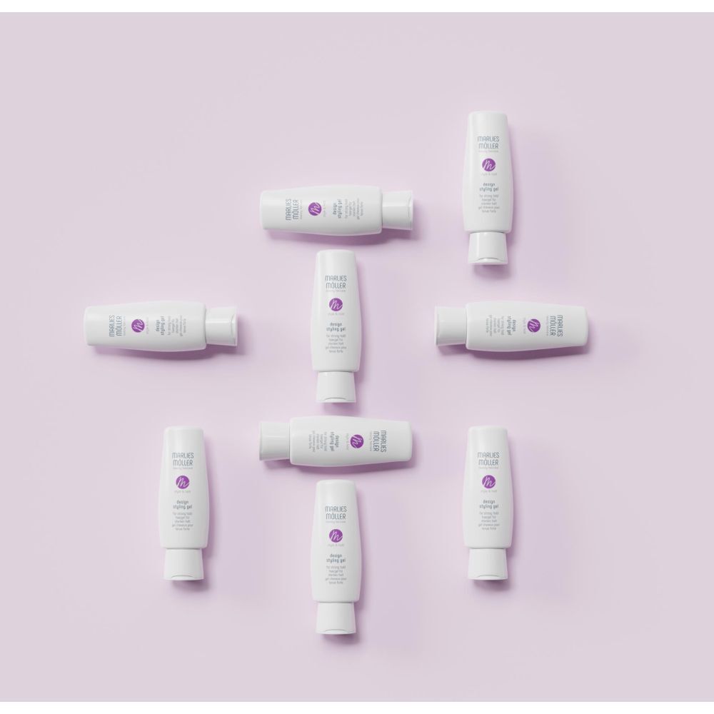 Mehrere weiße Design Styling Gel-Tuben auf lila Hintergrund. Marke Marlies Möller.