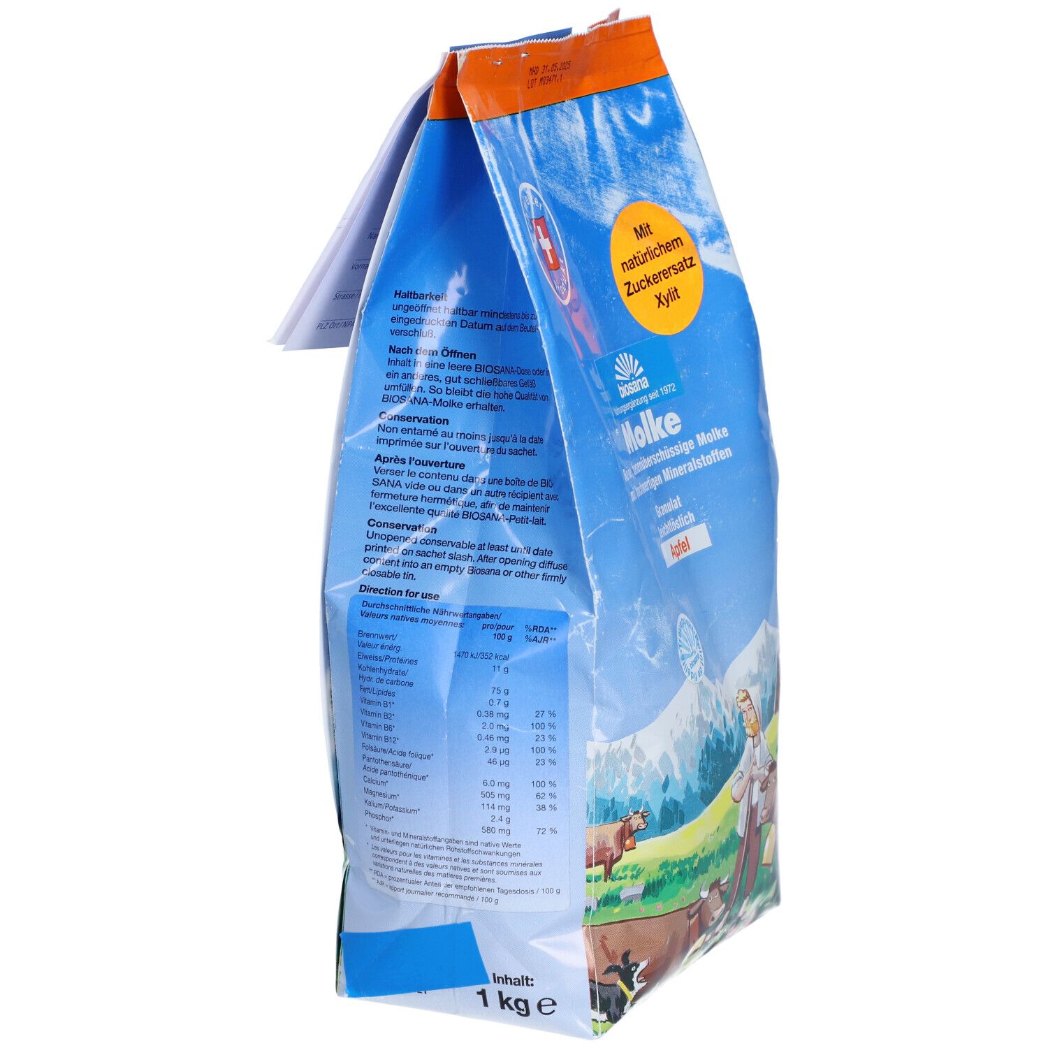 Sachet bleu, vue latérale. Texte: "Molke", "1 kg". Dos avec texte et informations nutritionnelles. Logo croix suisse.