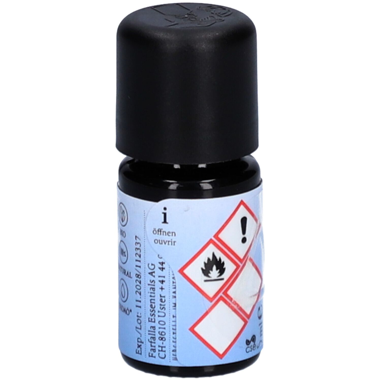 Petite bouteille en verre avec bouchon noir. Étiquette avec symboles de danger, instructions d'ouverture et informations fabricant.
