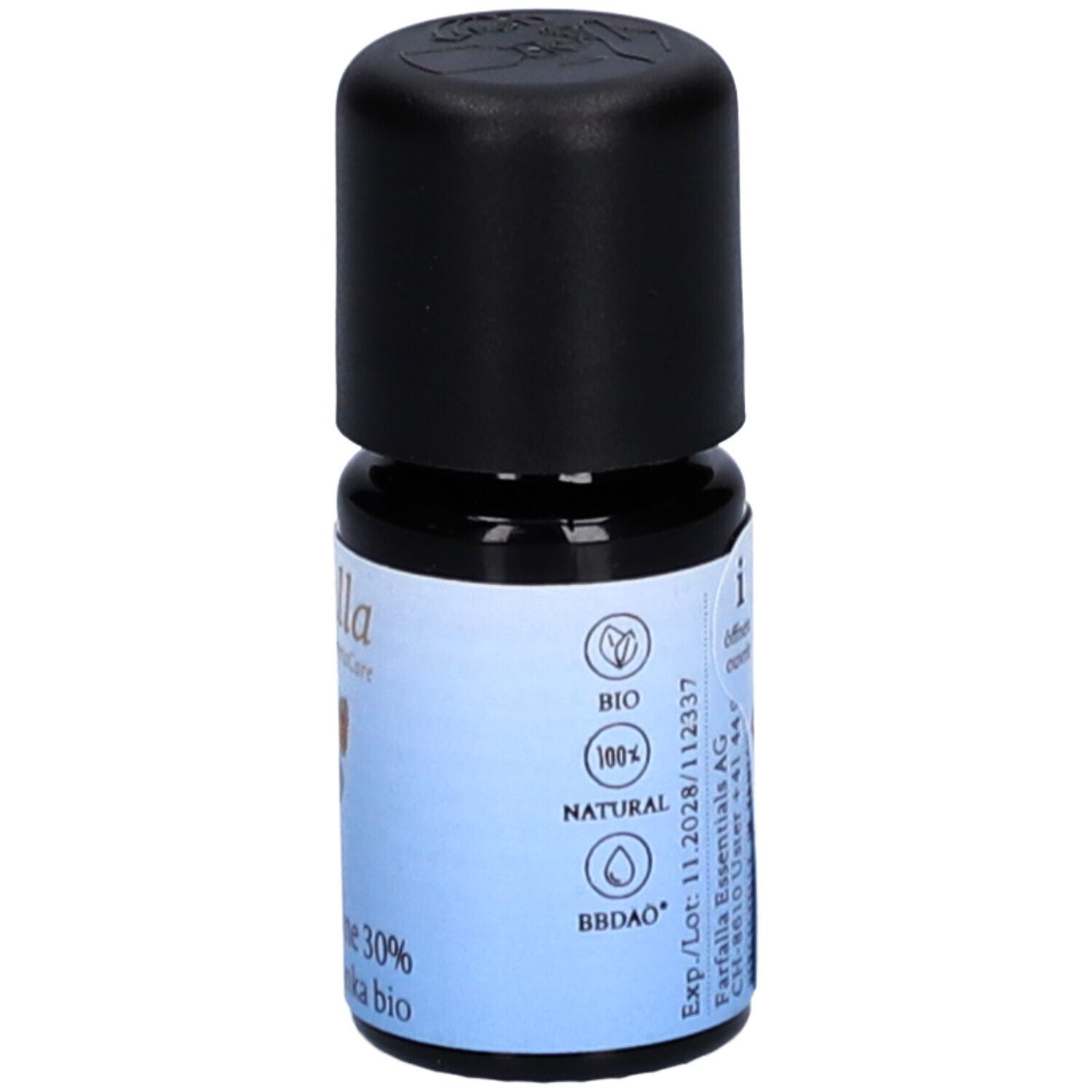 Petite bouteille en verre avec bouchon noir. Étiquette avec label bio, informations fabricant et indication de volume.