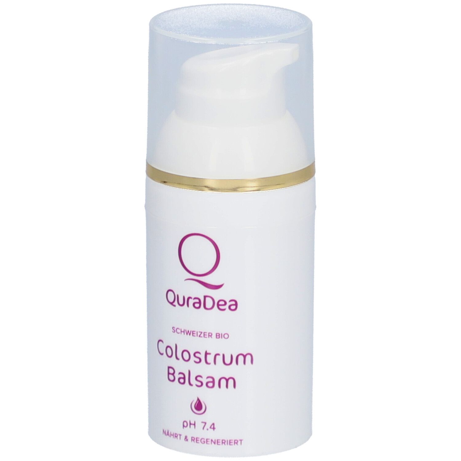 Weißer Spender mit transparentem Deckel. Goldener Ring. Aufschrift: QuraDea, Colostrum Balsam, pH 7.4.