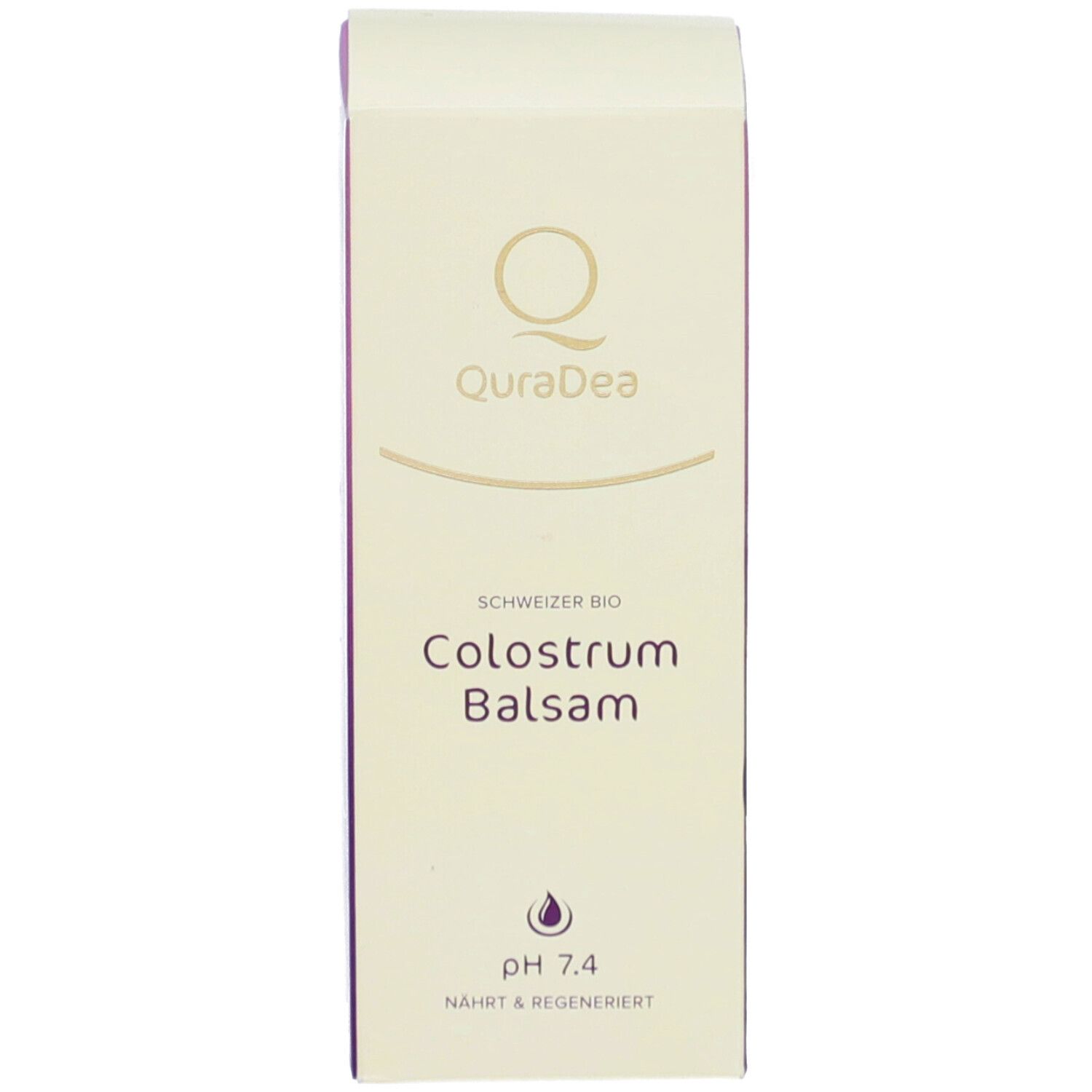 Produktverpackung. Weiß mit Aufschrift QuraDea, Colostrum Balsam, pH 7.4. Logo und Produktinformationen.