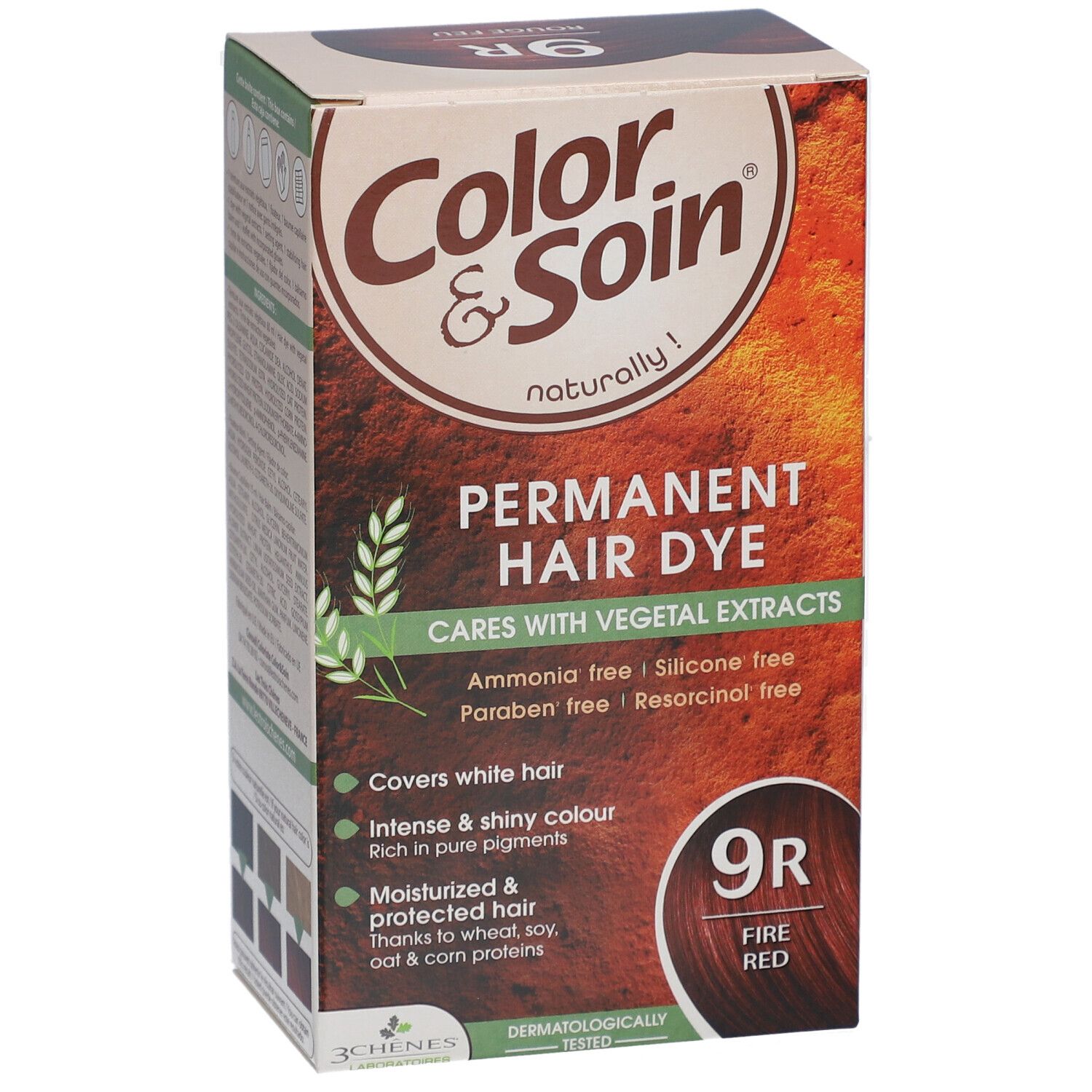 Boîte de coloration capillaire. Inscription : Color & Soin, 9R Rouge Feu. Contient des extraits végétaux. Couvre les cheveux blancs.
