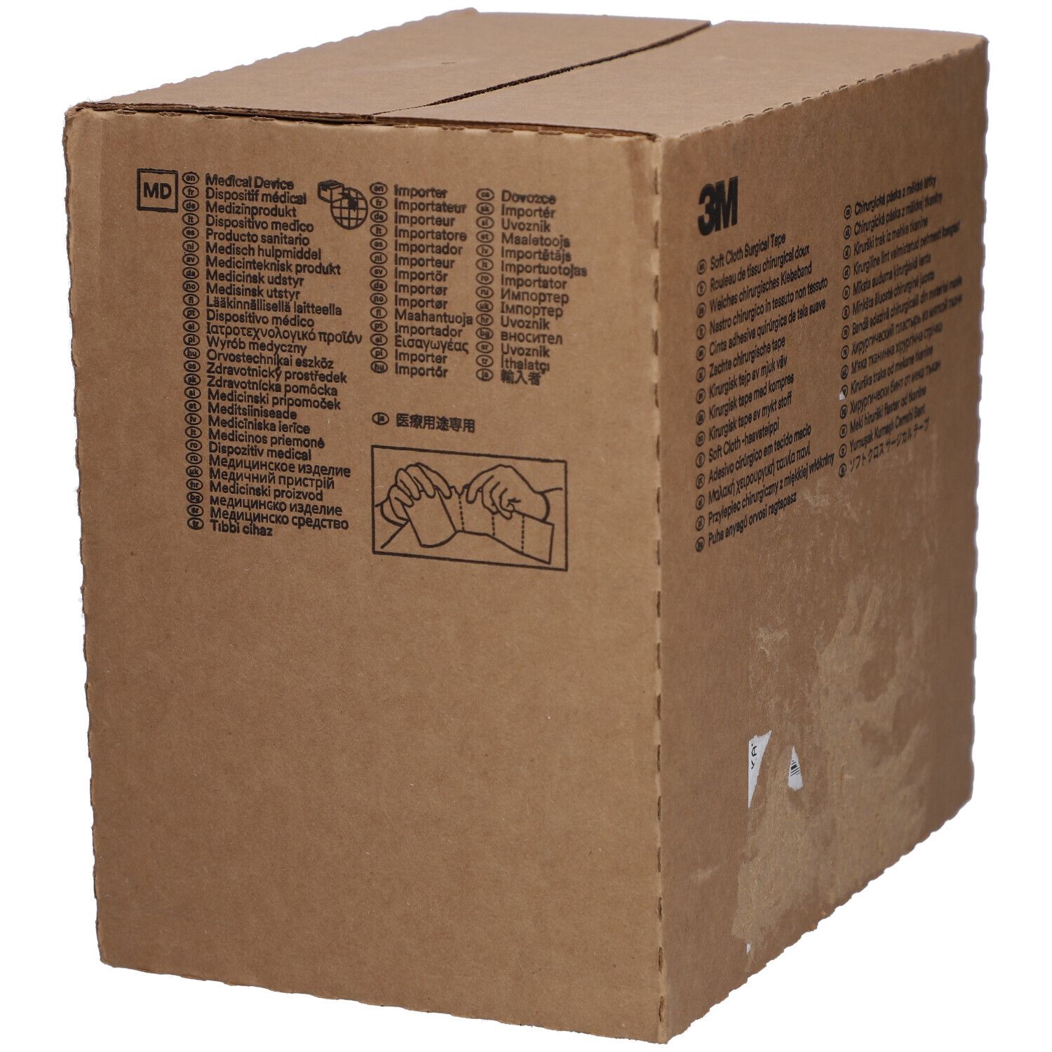 Boîte en carton marron avec texte. La boîte indique "3M Soft Cloth Surgical Tape".