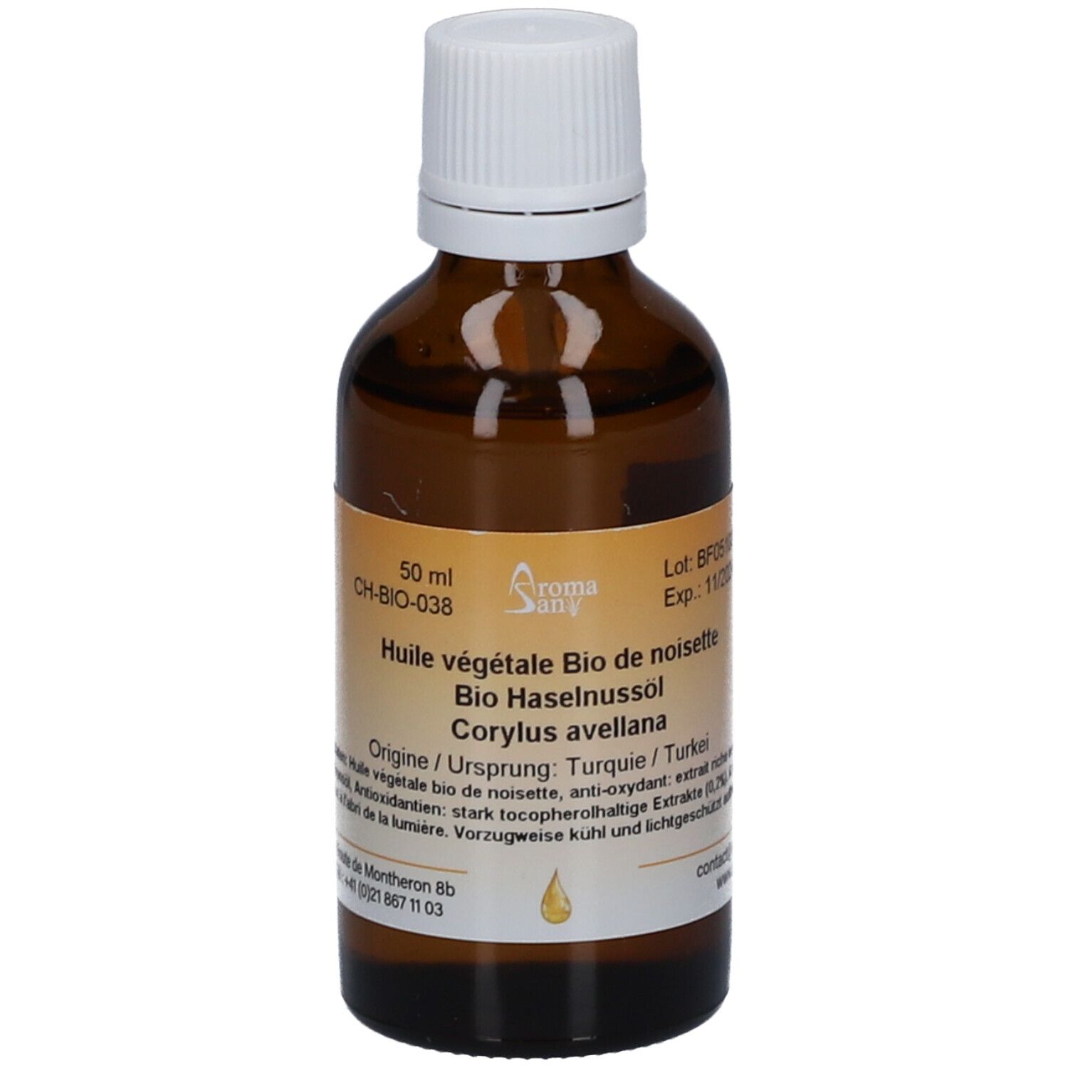 Bruine glazen fles met witte dop. Etiket met productnaam, ingrediënten en batchnummer. Druppelsymbool.