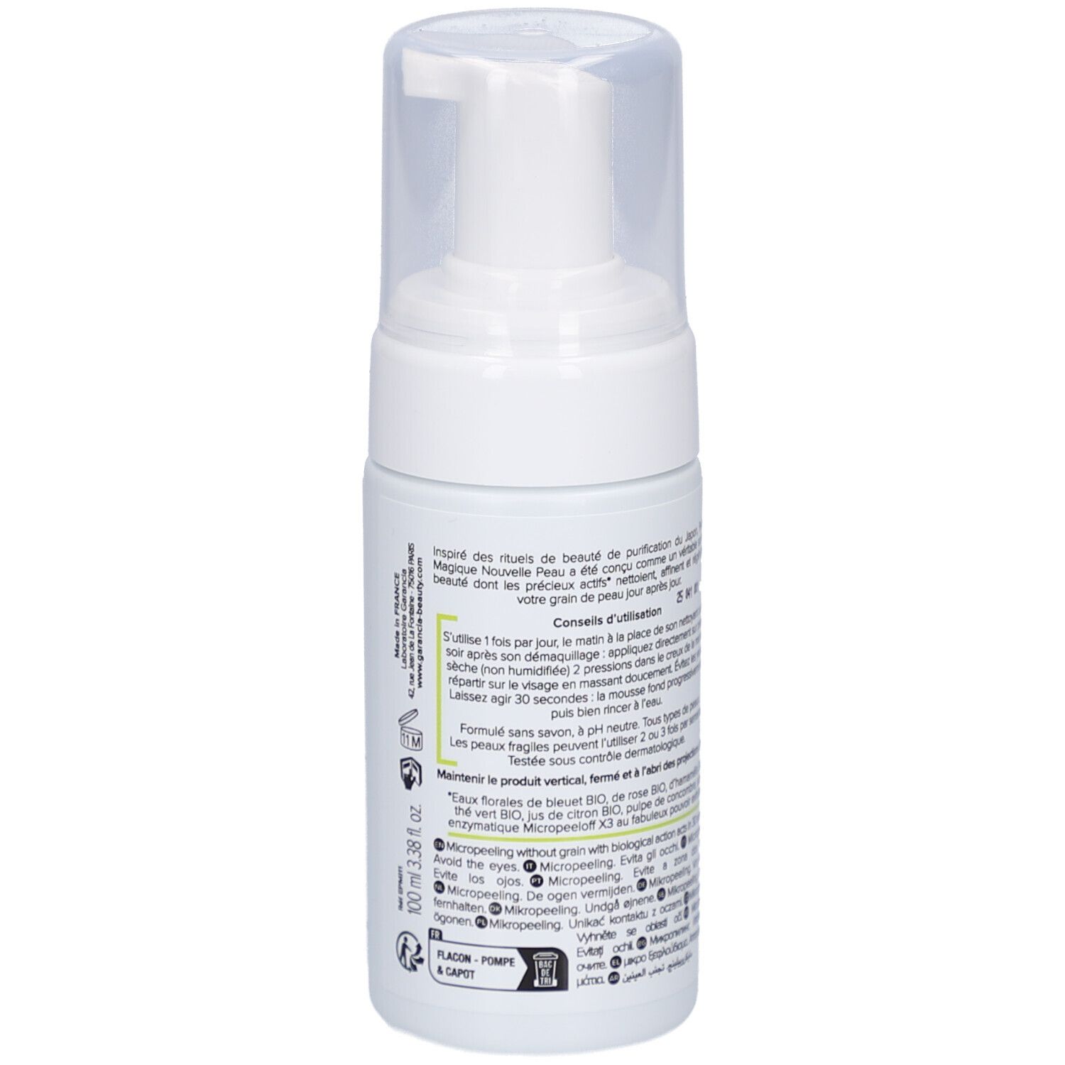 Weiße Flasche mit Sprühkopf. Aufschrift: GARANCIA, Pschitt Magique, Nouvelle Peau, Visage. Text in Französisch.
