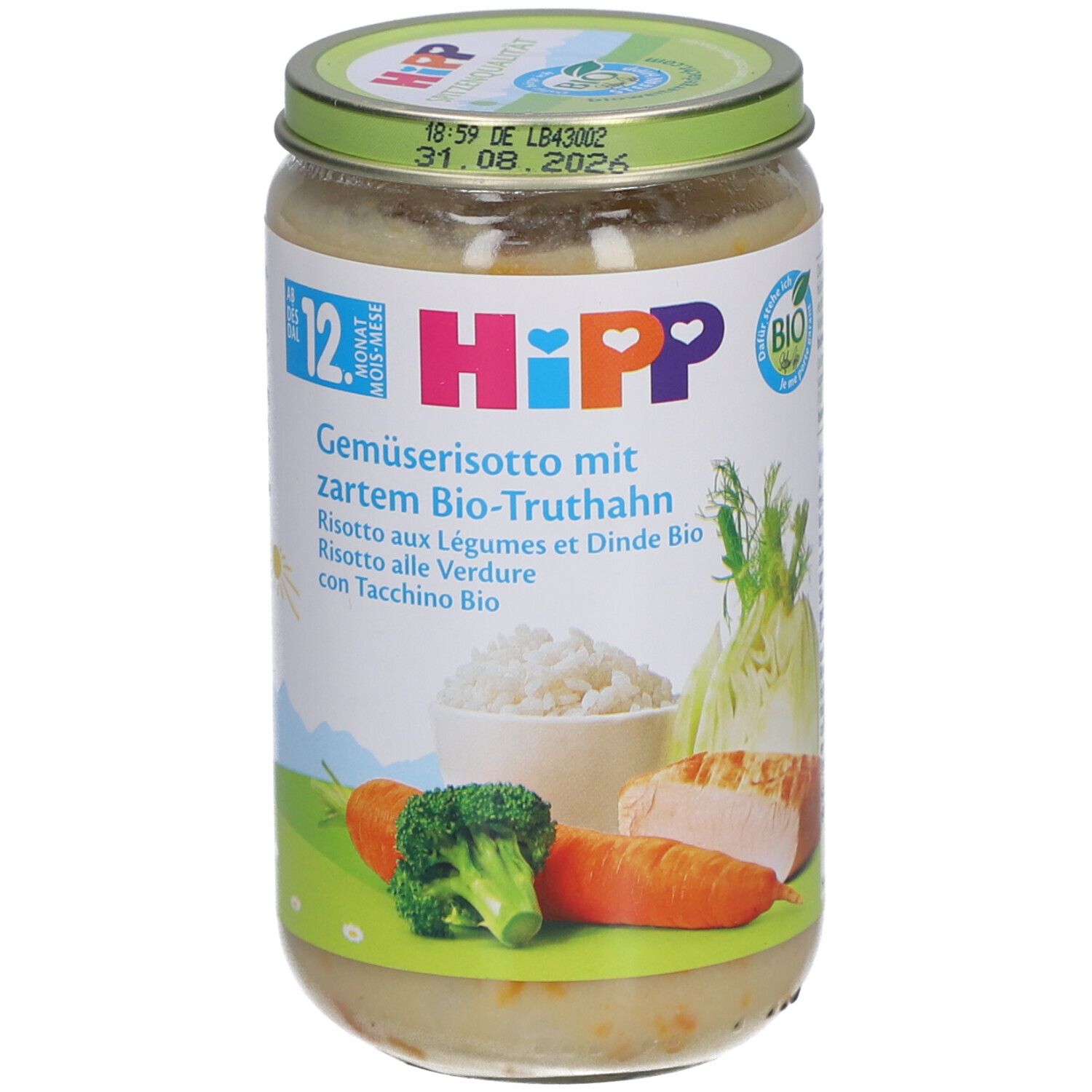 Bocal de risotto aux légumes et dinde bio HiPP. Étiquette avec ingrédients et logo. Couvercle vert avec date limite.